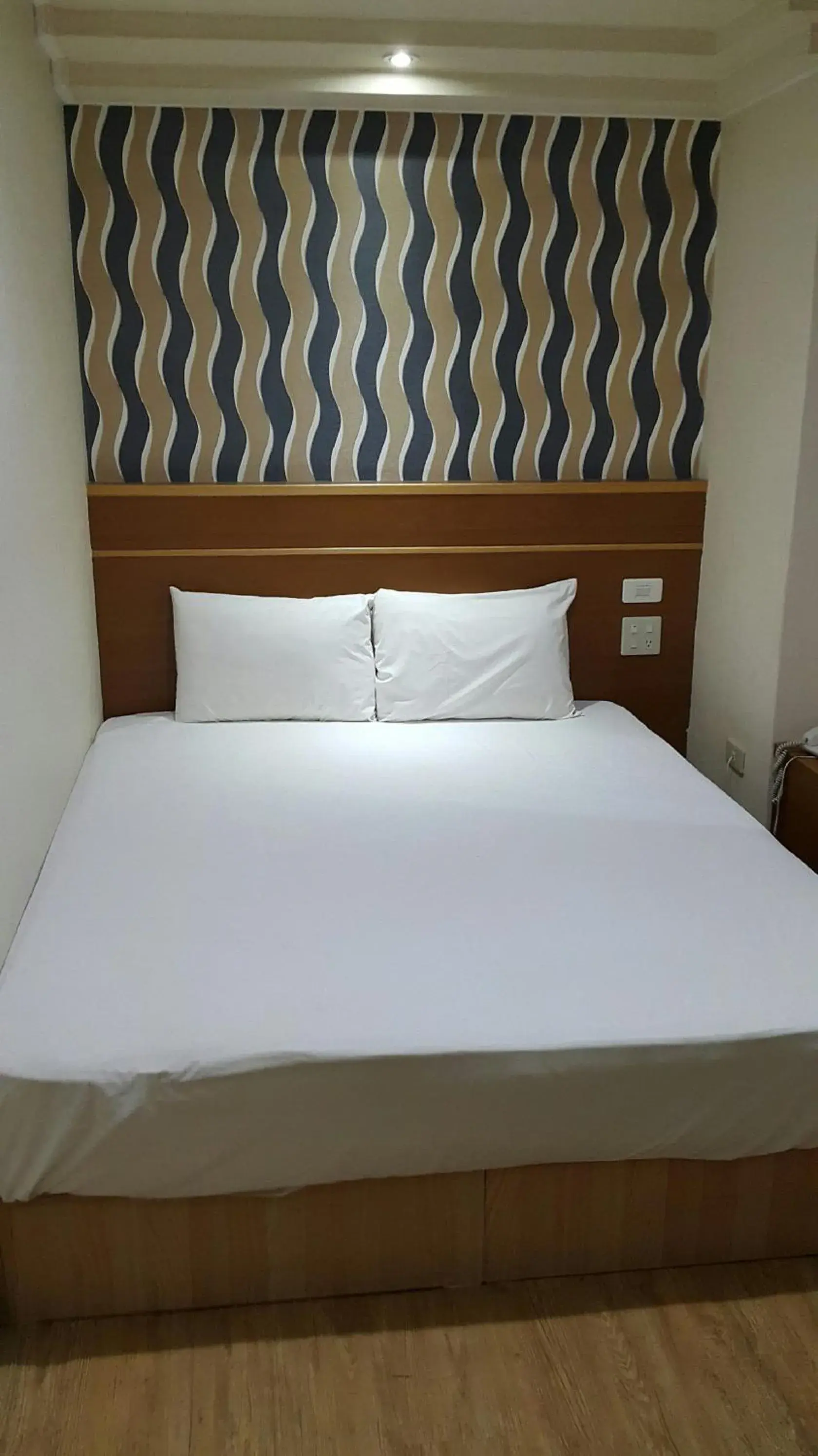 Bed in Mei-Hua Hotel