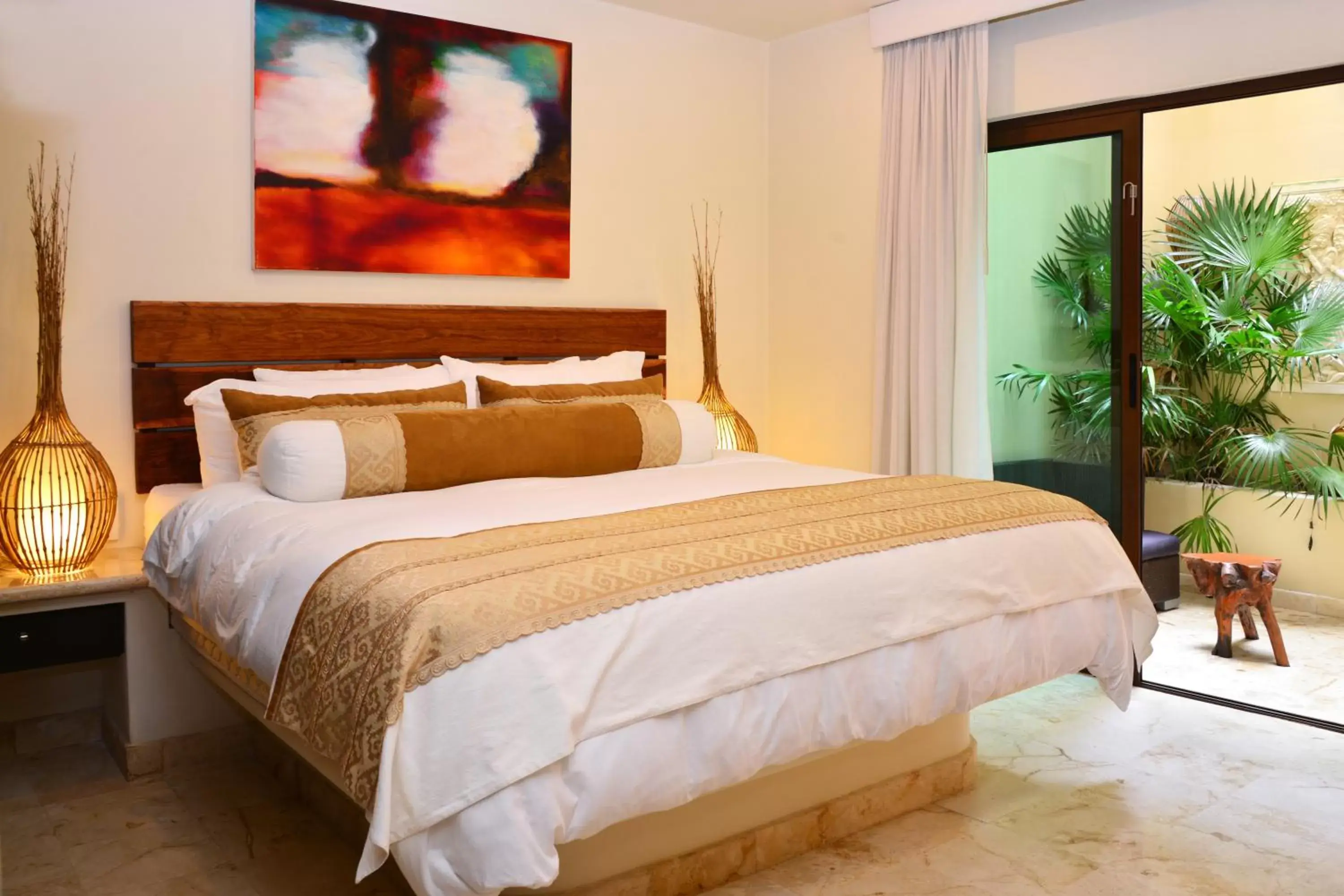 Bed in El Taj Oceanfront and Beachside Condo Hotel