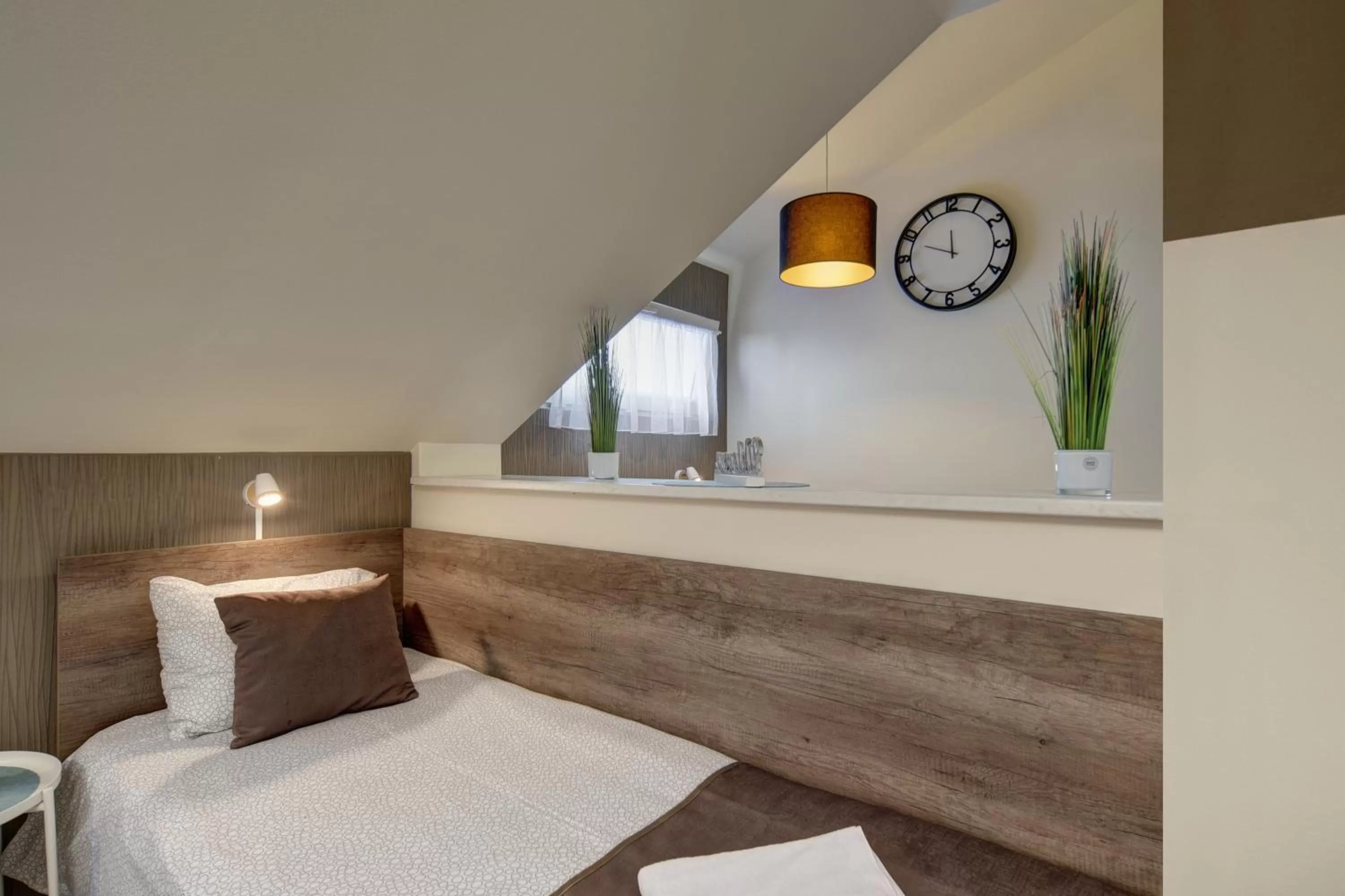 Bed in Familia Panzió & Apartmanház Győr