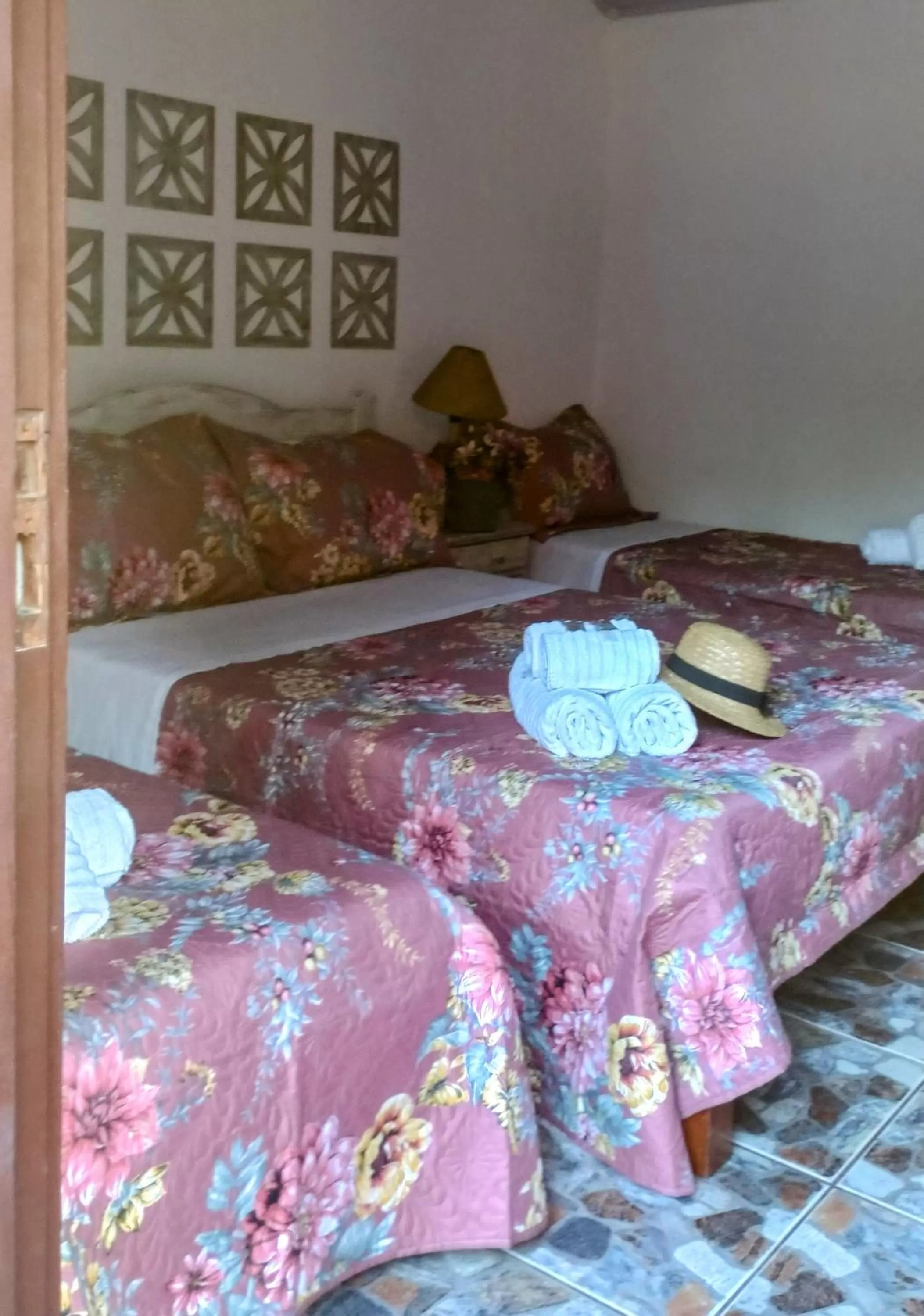 Bed in Hibiscos Pousada