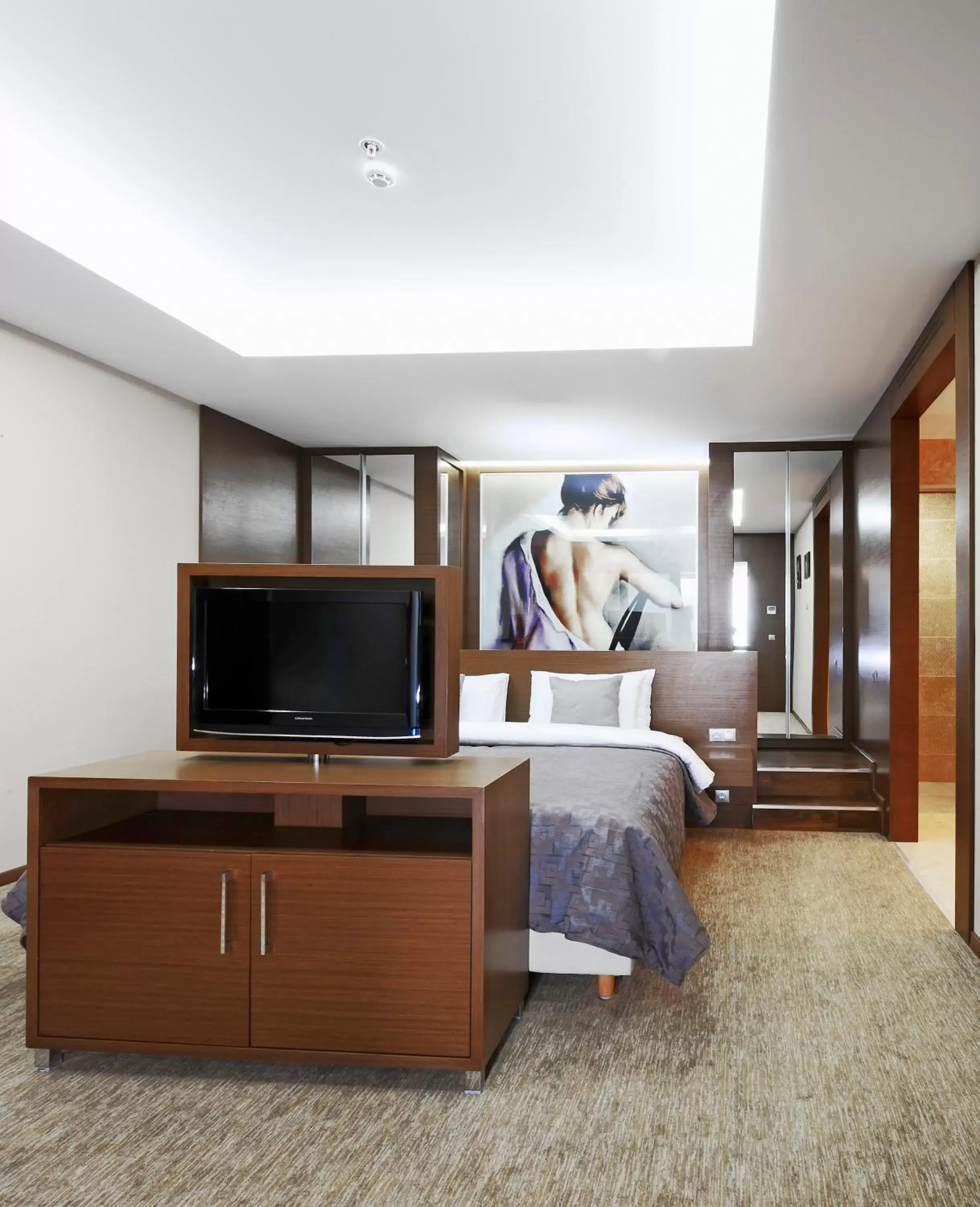 Bed, TV/Entertainment Center in Ramada by Wyndham Podgorica