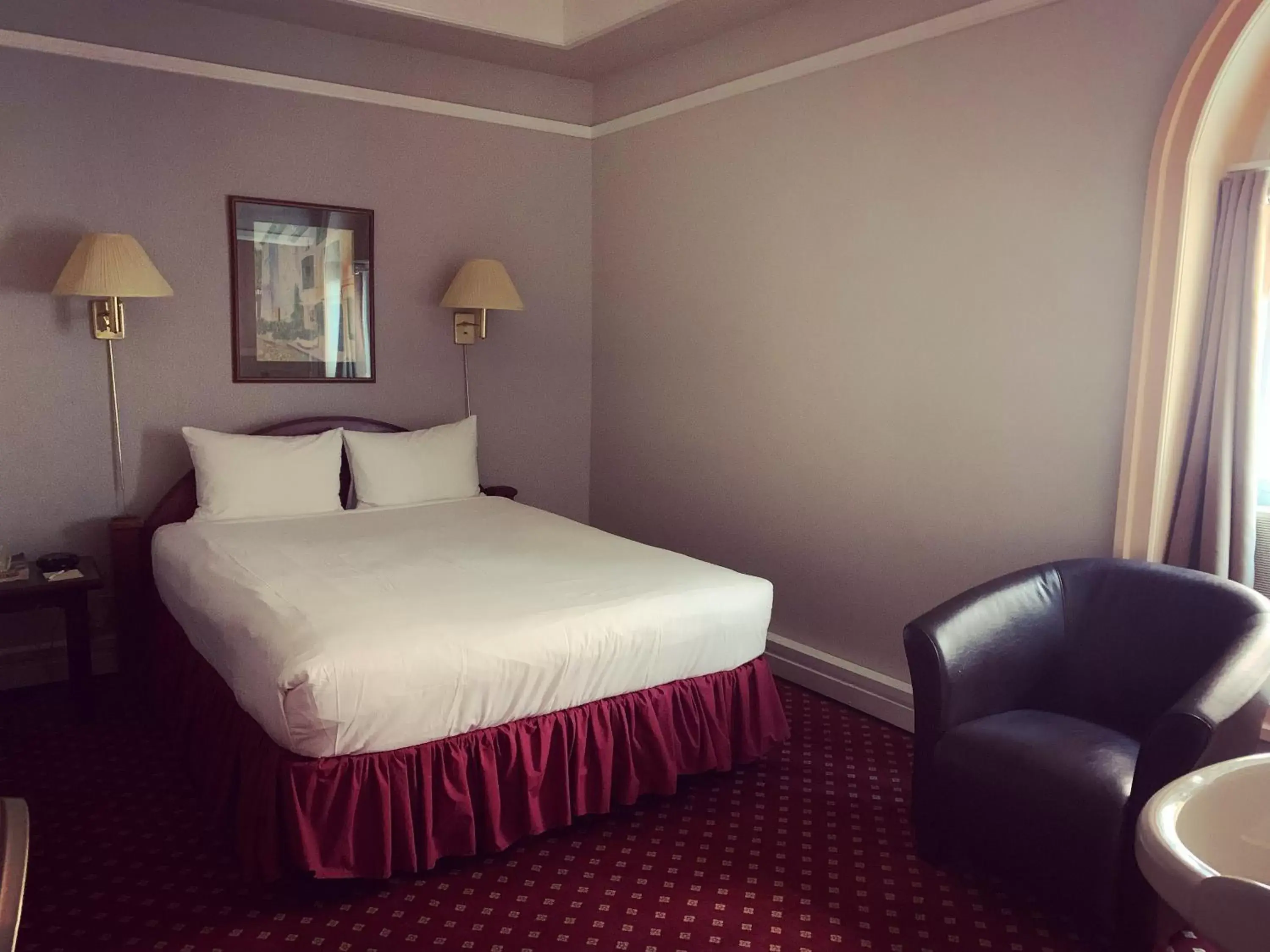 Bed in The Bedford Regency Hotel