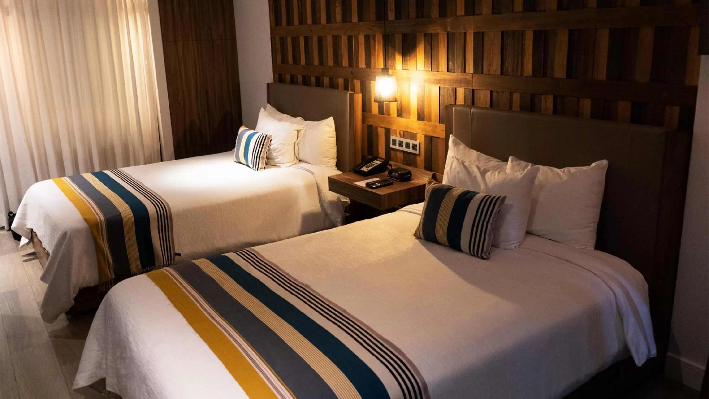 Bed in Hotel Indigo Guadalajara Expo by IHG