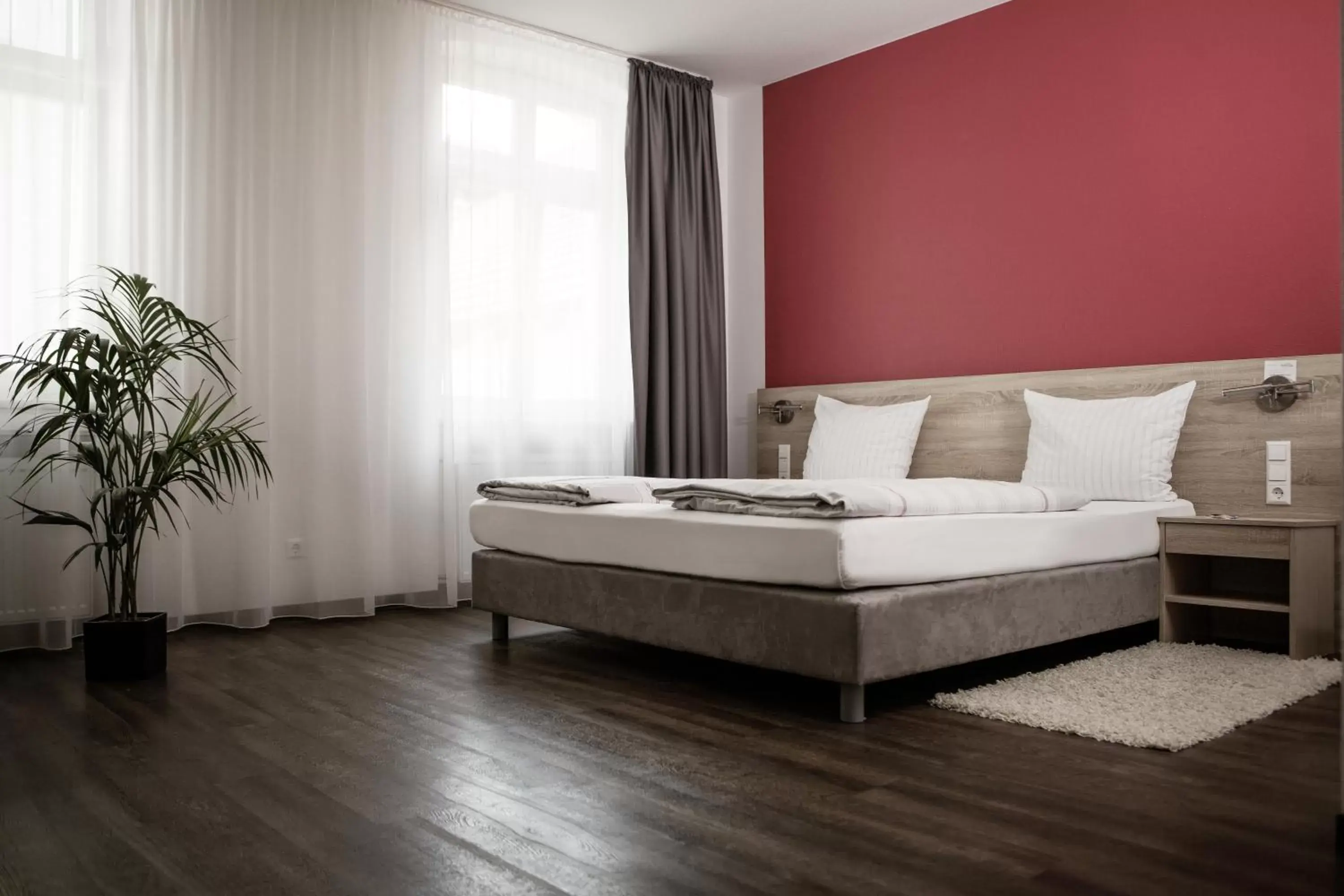 Bed, Seating Area in Hotel Bayrischer Hof