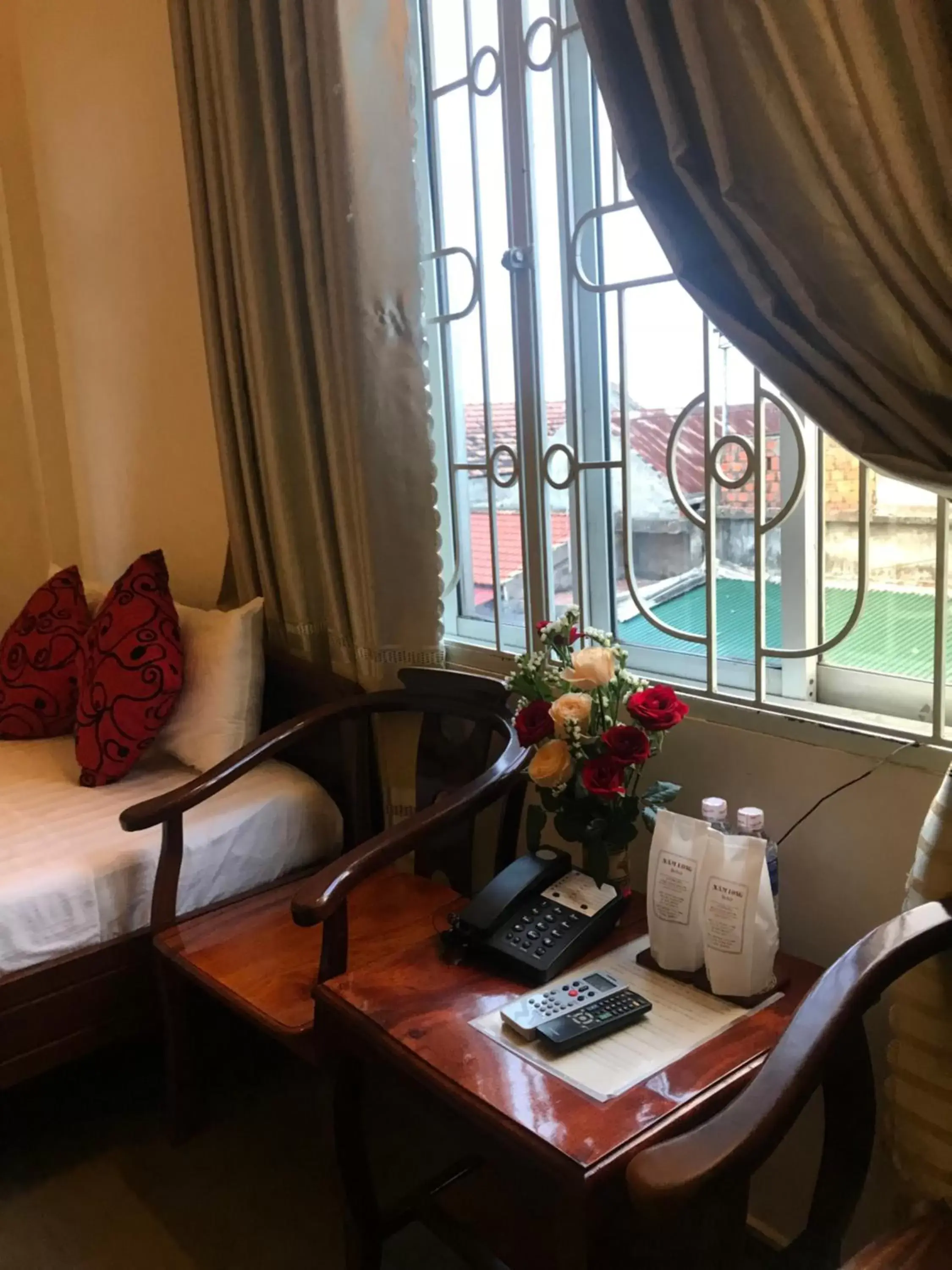 Seating area, Bed in Nam Long Hotel Seating area, Bed in Nam Long Hotel