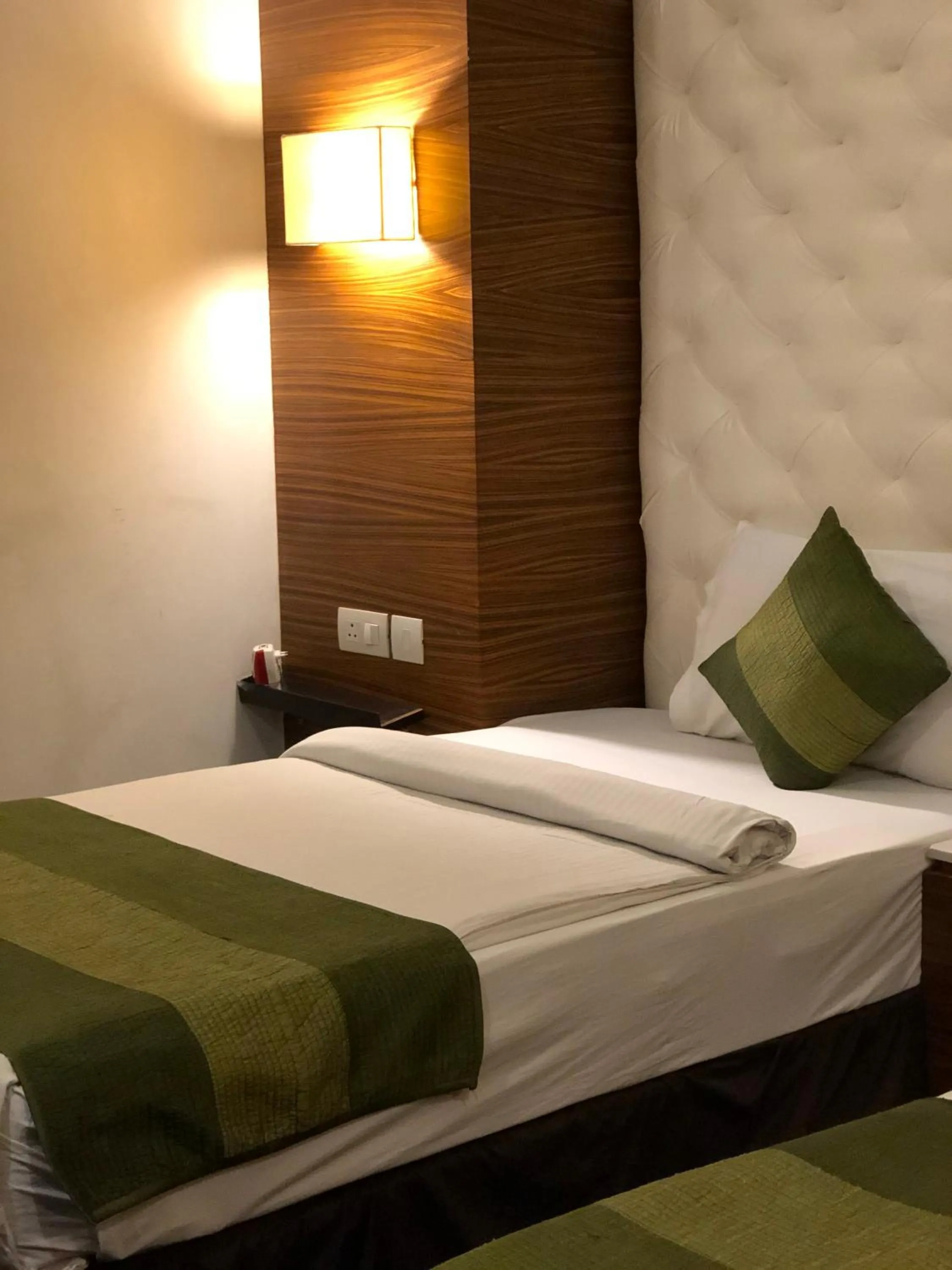 Bed in Hotel Ivory 32