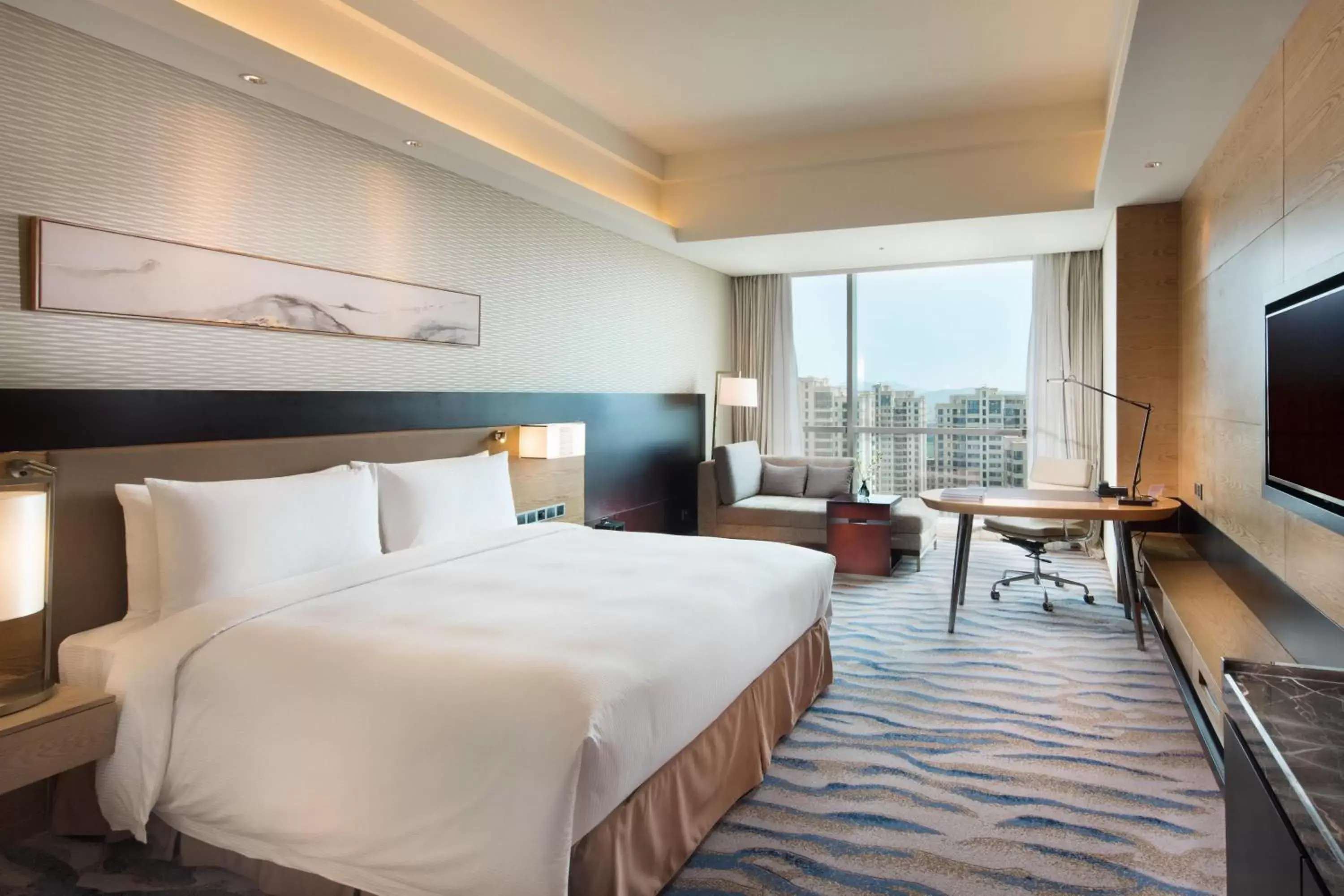 Property building, Bed in Hilton Yantai Golden Coast Property building, Bed in Hilton Yantai Golden Coast