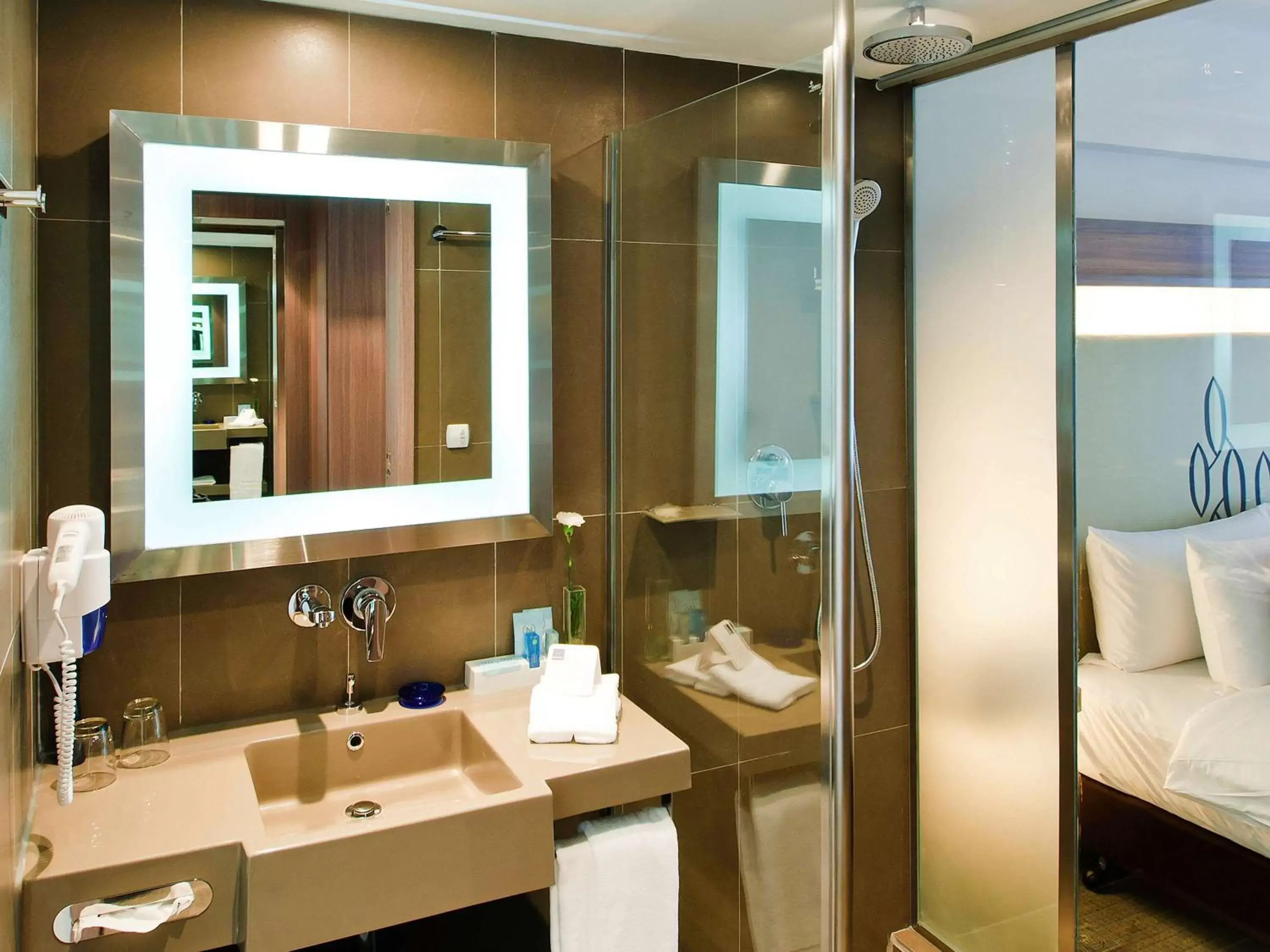 Photo of the whole room, Bathroom in Novotel Bangkok Silom Road Hotel