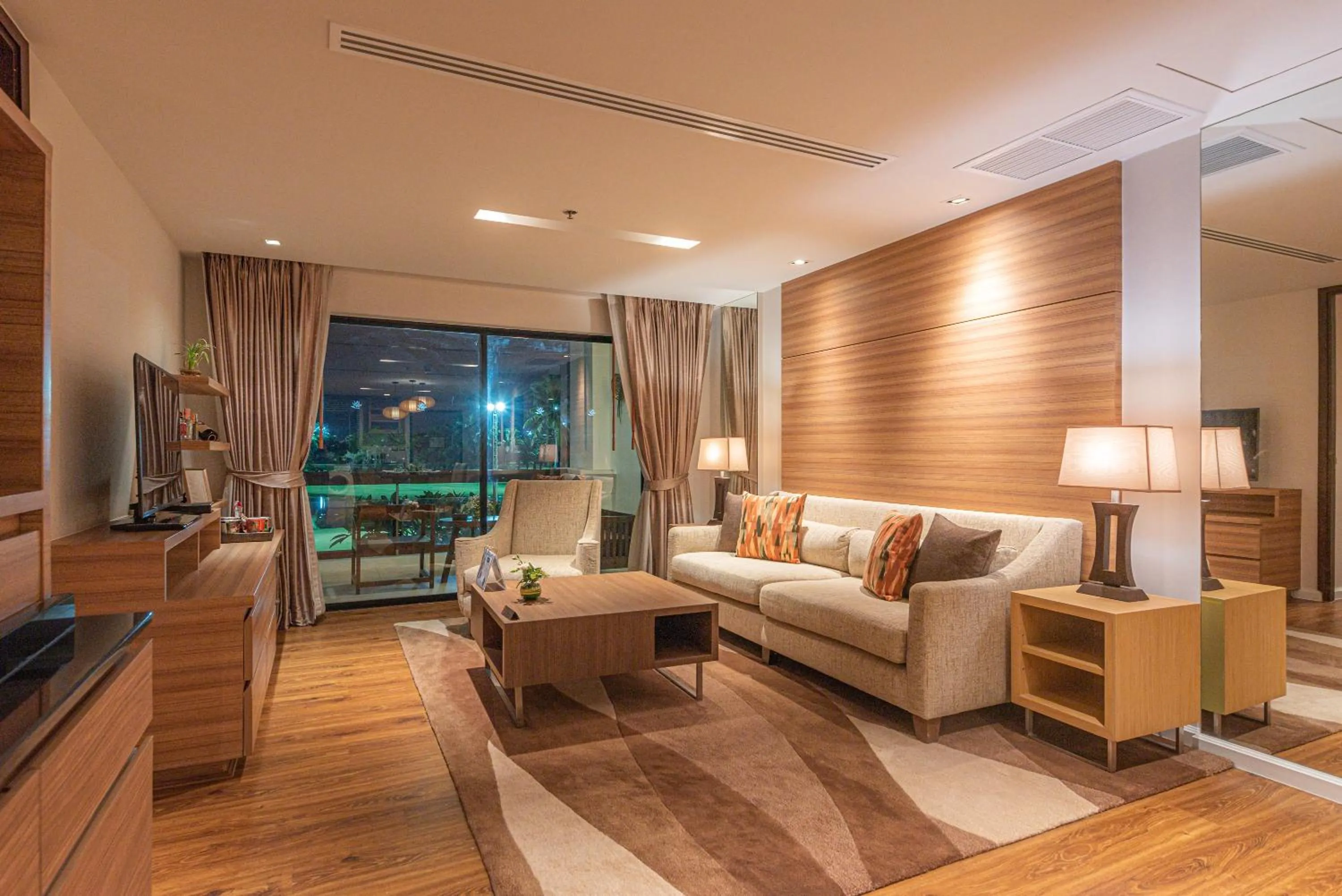 Living room in Summit Windmill Golf Suite Hotel at Suvarnabhumi