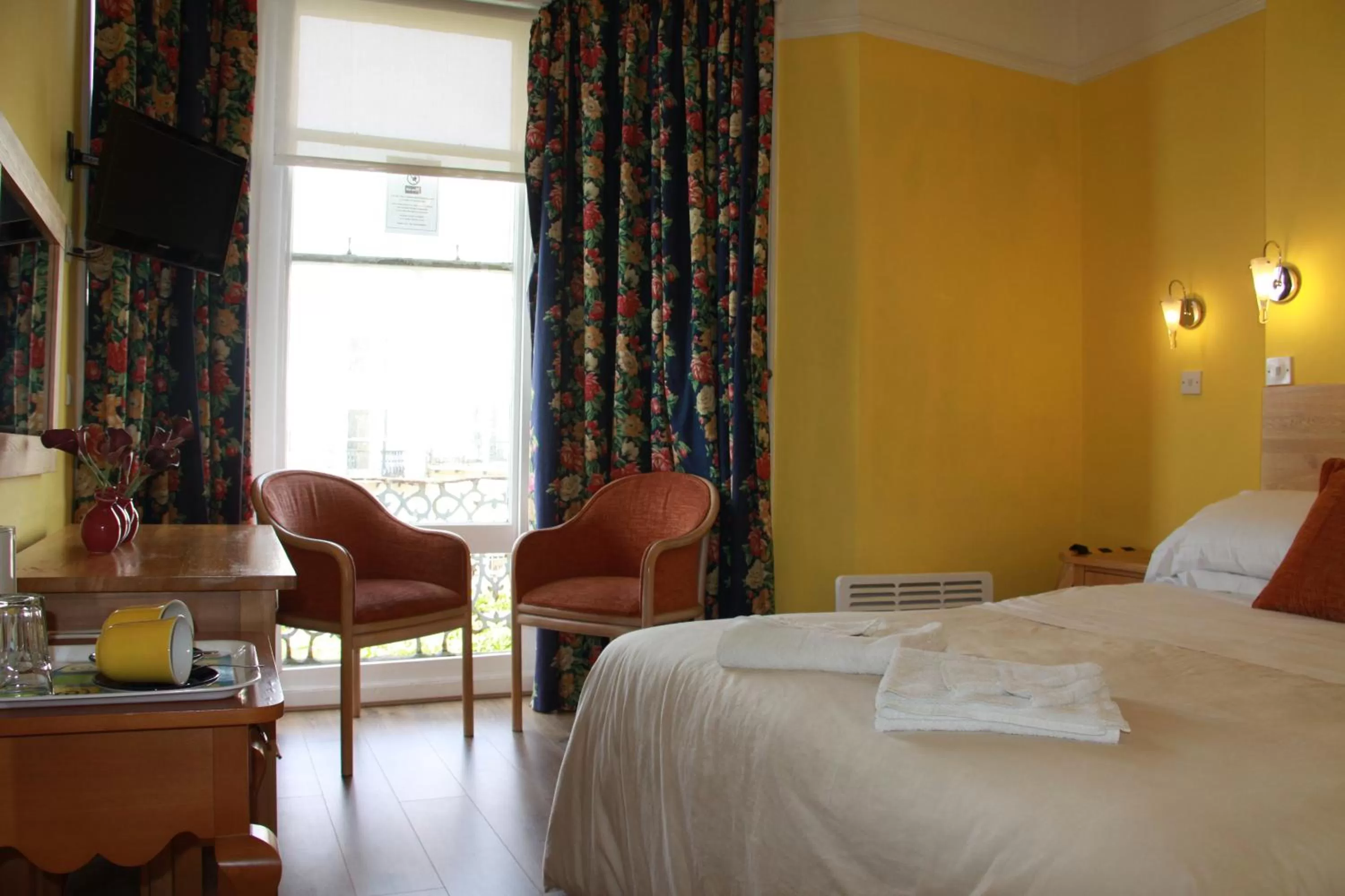 Bed in Ambassador Hotel