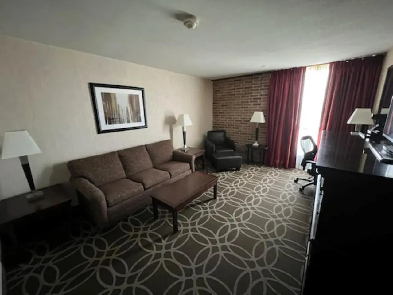 TV and multimedia, Seating Area in Hotel Lotus Kansas City Merriam