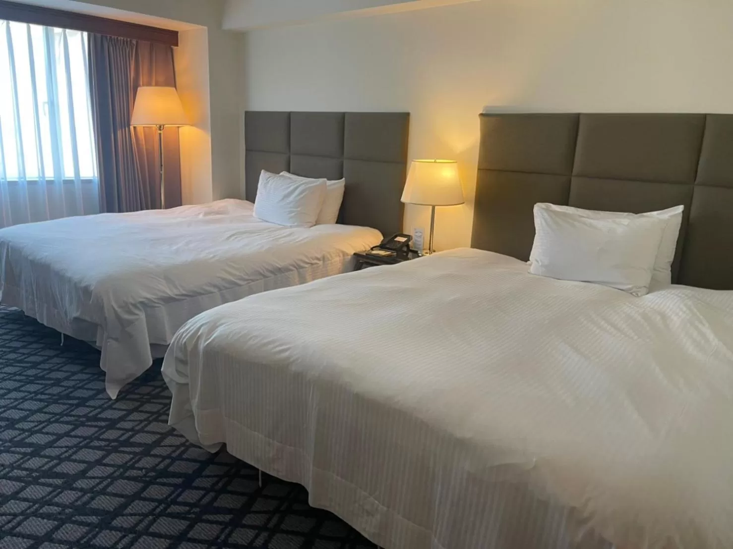 Bed in The Howard Plaza Hotel Kaohsiung