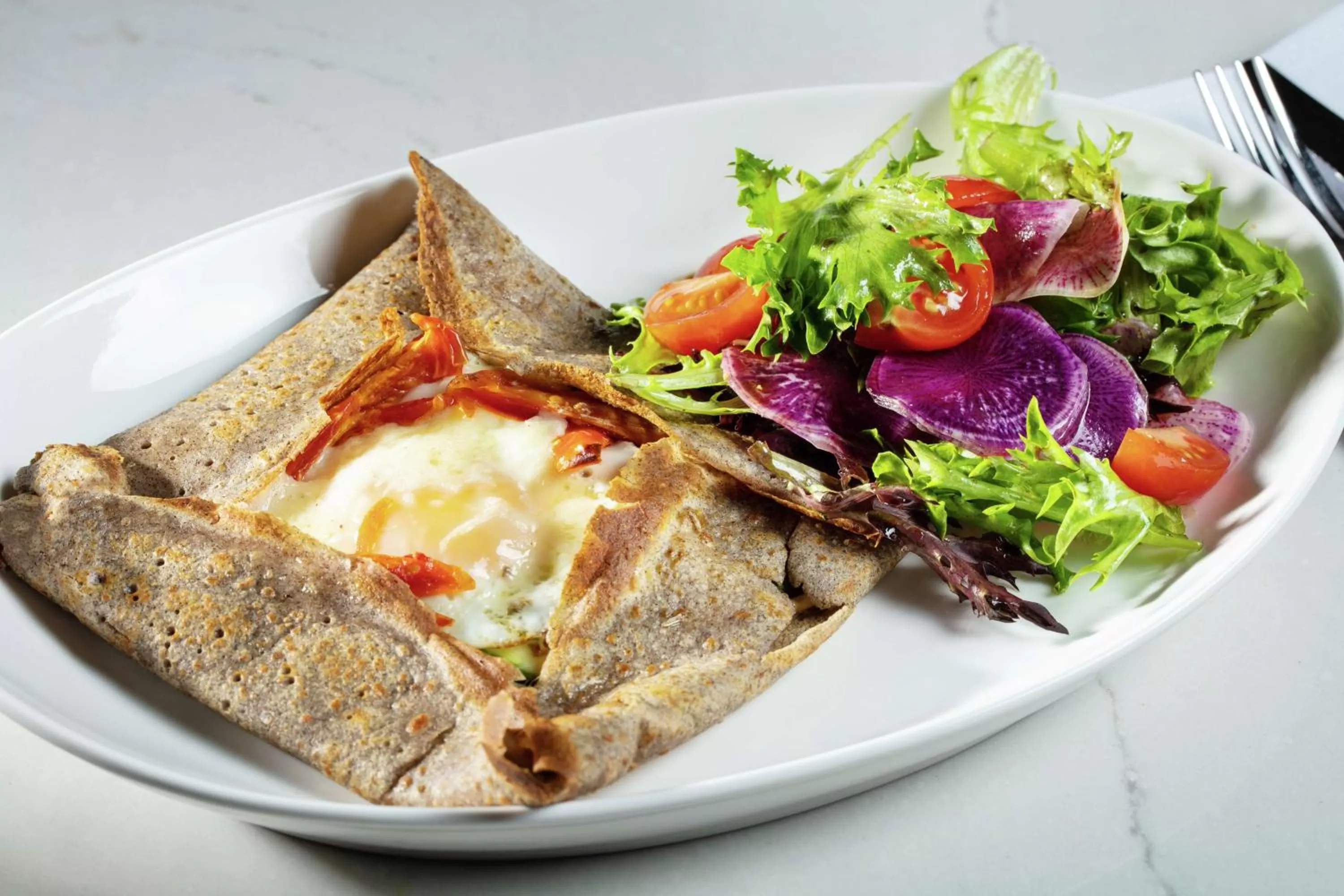 Dining area in The Higgins Hotel New Orleans, Curio Collection by Hilton
