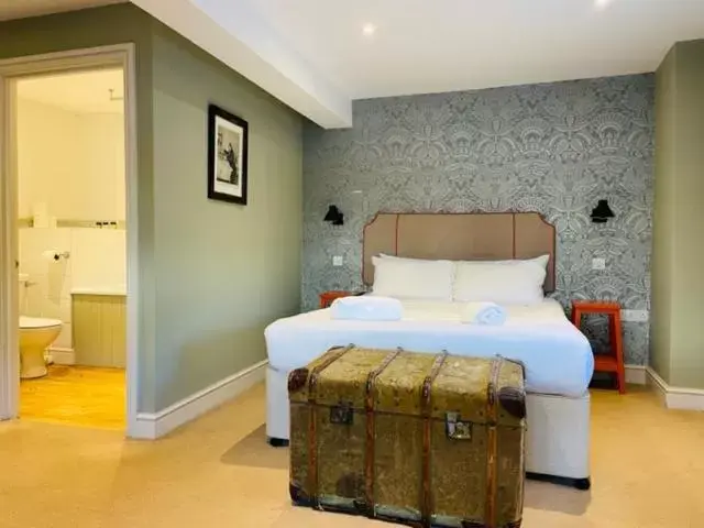 Bed in The Greyhound Inn