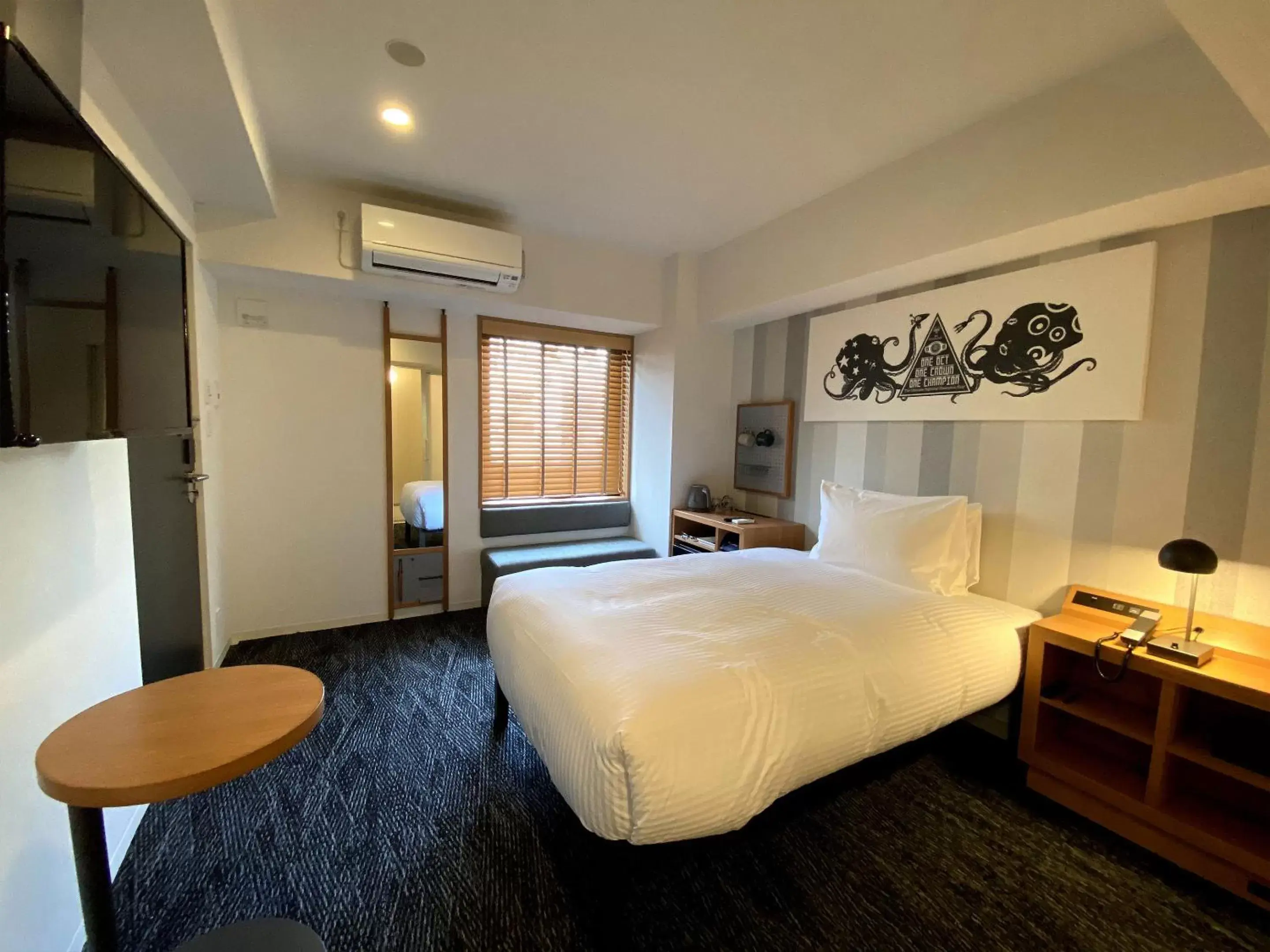 Bed in UMEDAHOLIC HOTEL