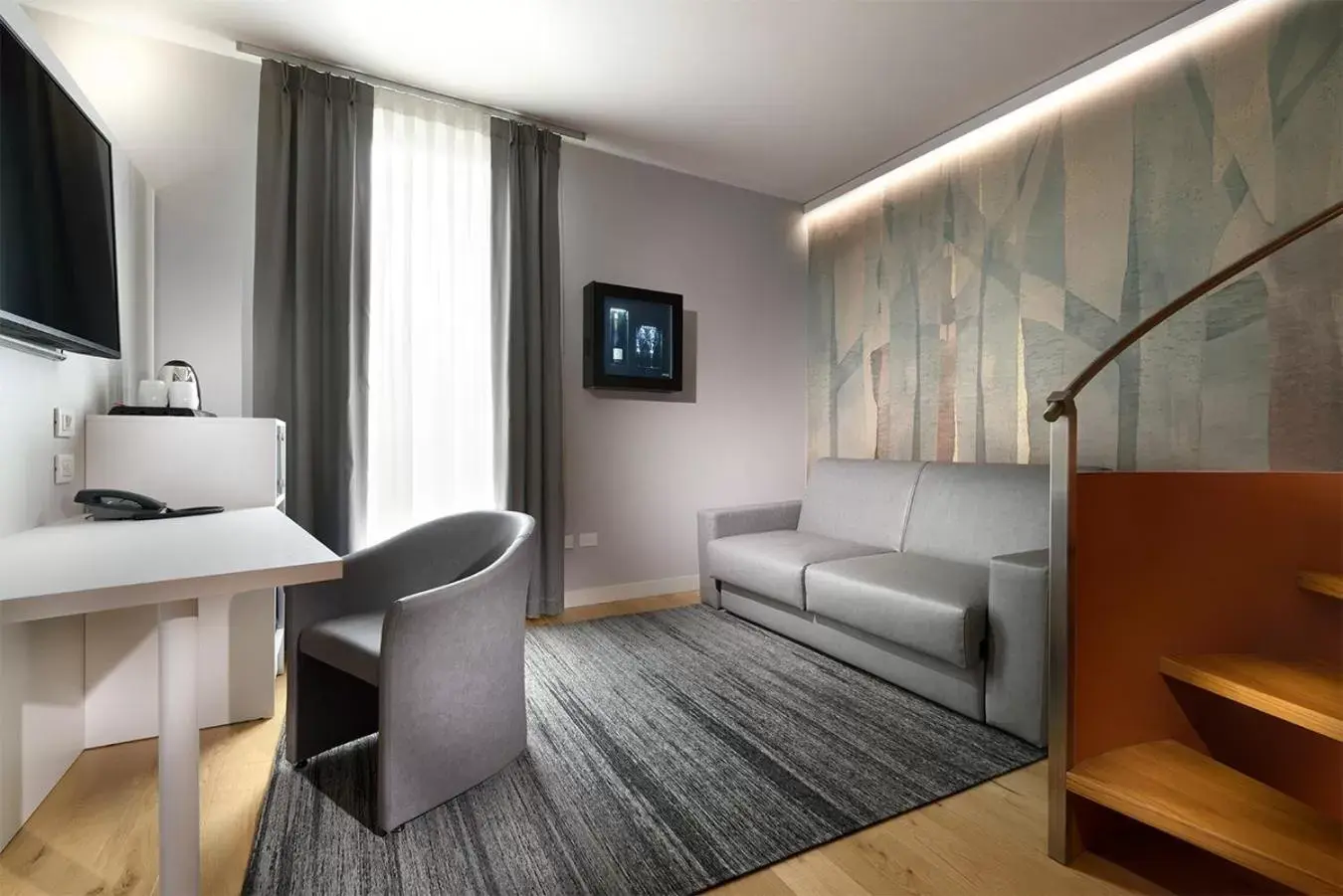 Bedroom, TV/Entertainment Center in GHV Hotel