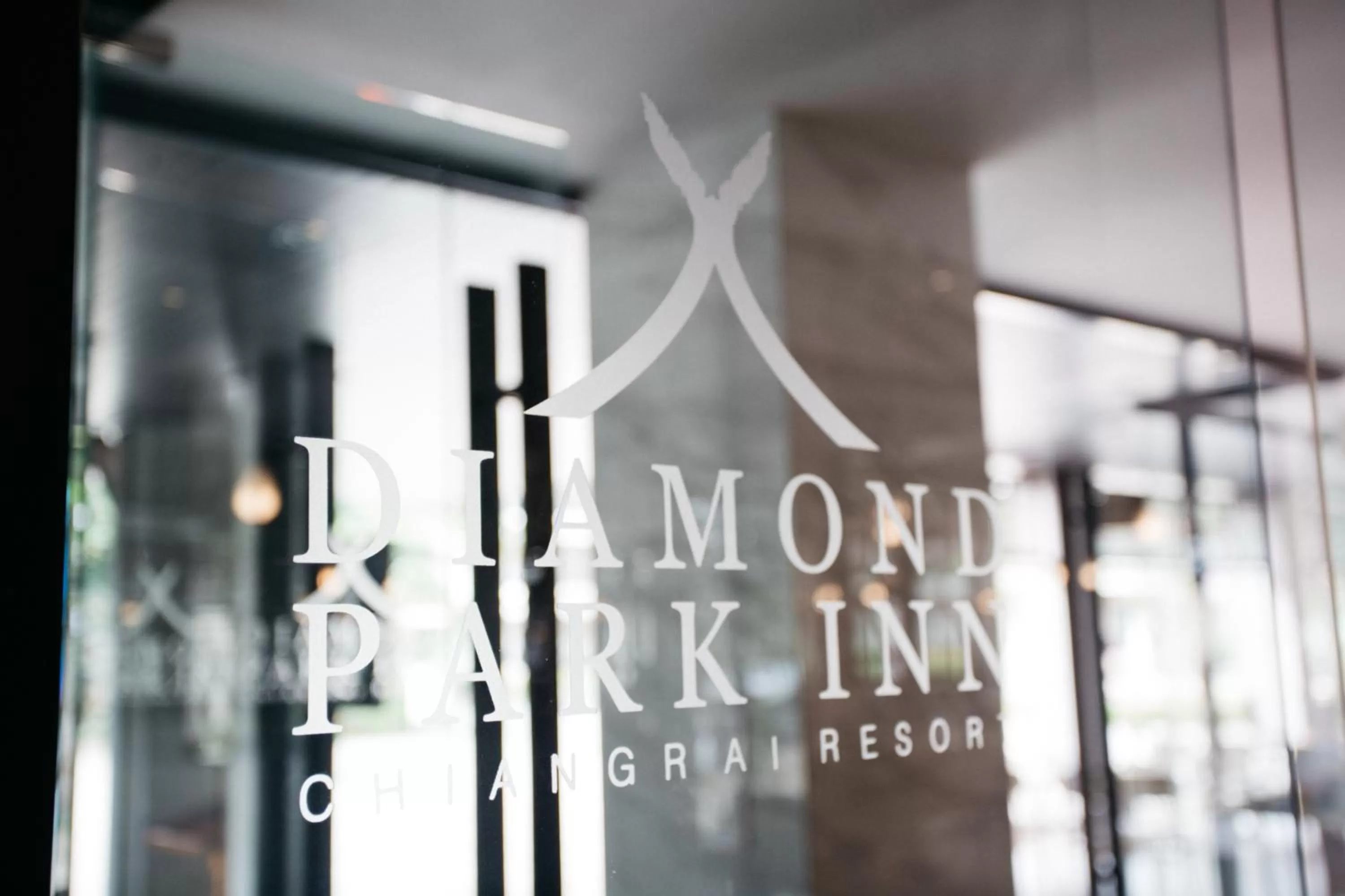 Text overlay in Diamond Park Inn Chiangrai & Resort