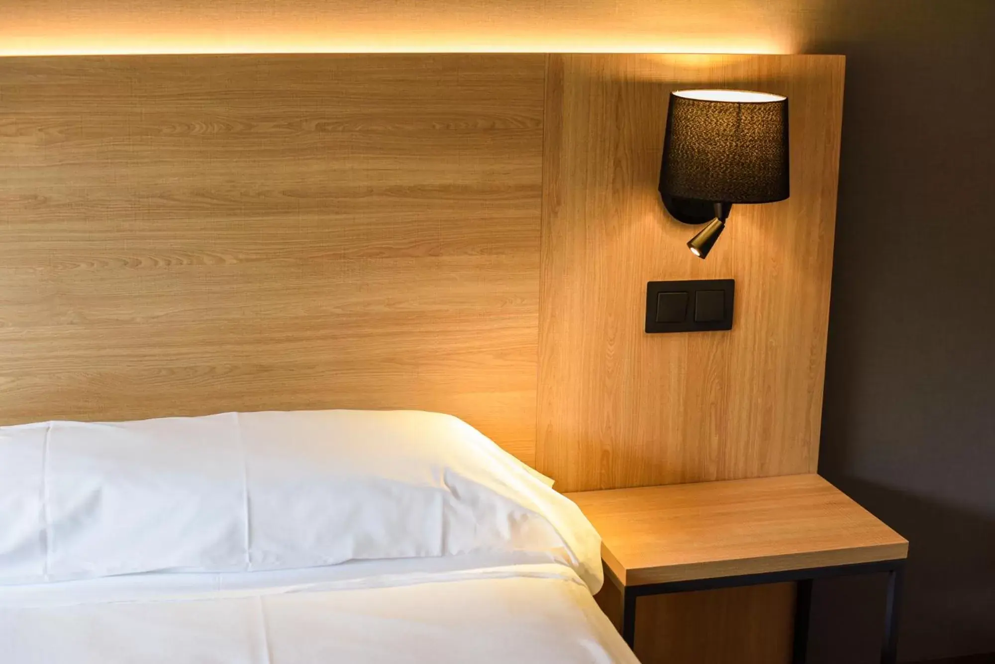 Bed in SOMMOS Hotel Benasque Spa Bed in SOMMOS Hotel Benasque Spa