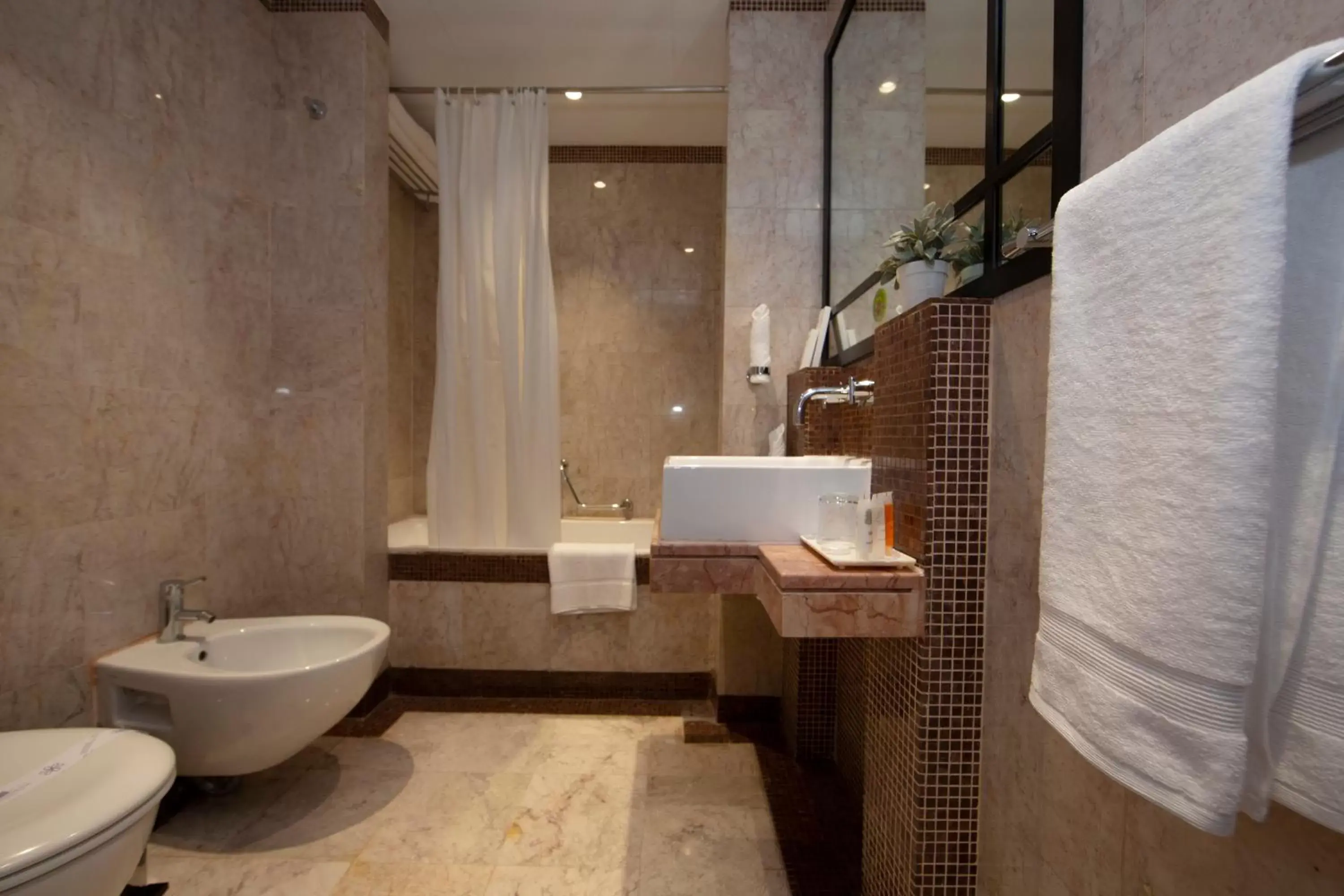 Bathroom in Number One Tower Suites Hotel