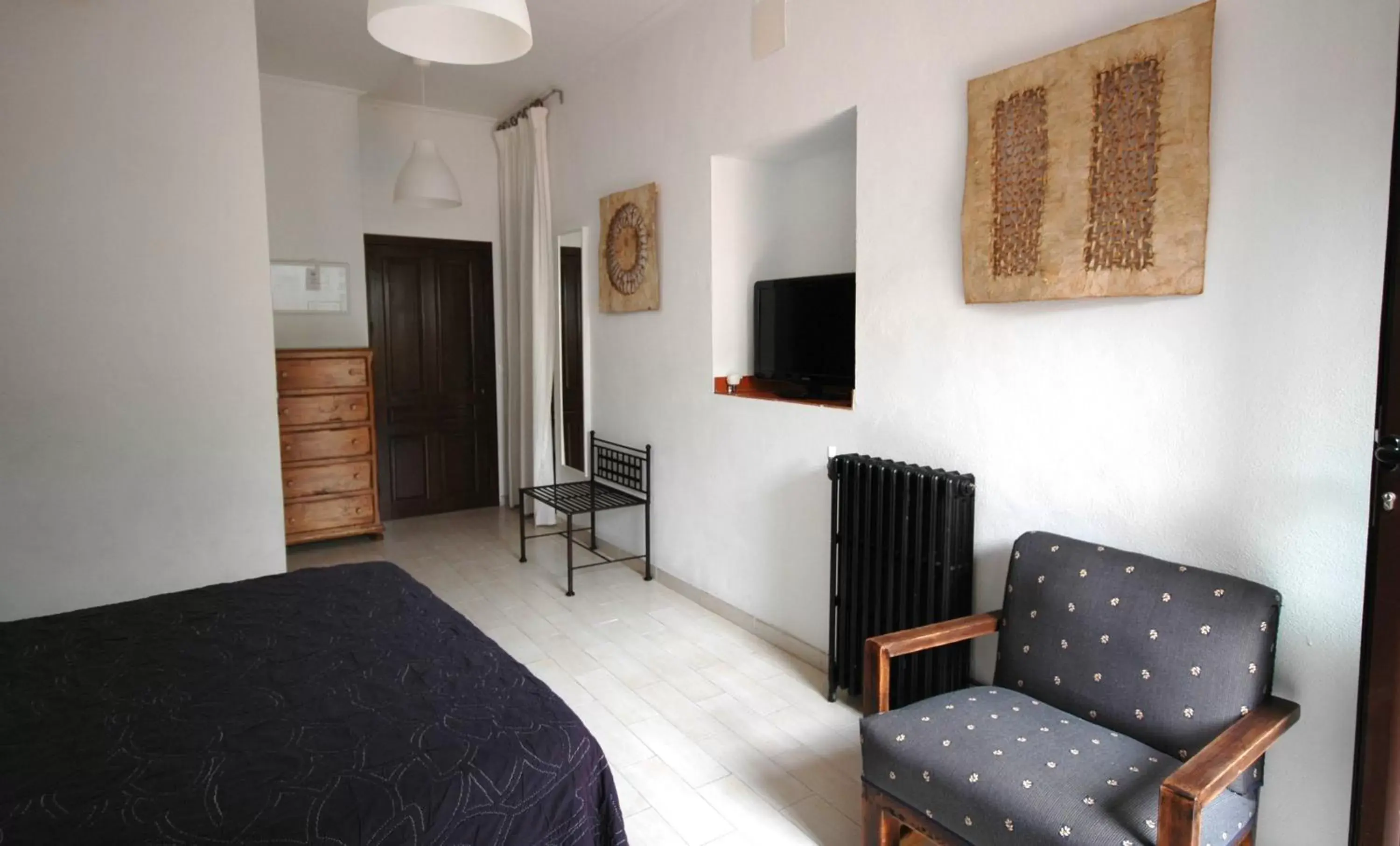 Bed, TV/Entertainment Center in Hotel Casa de los Azulejos