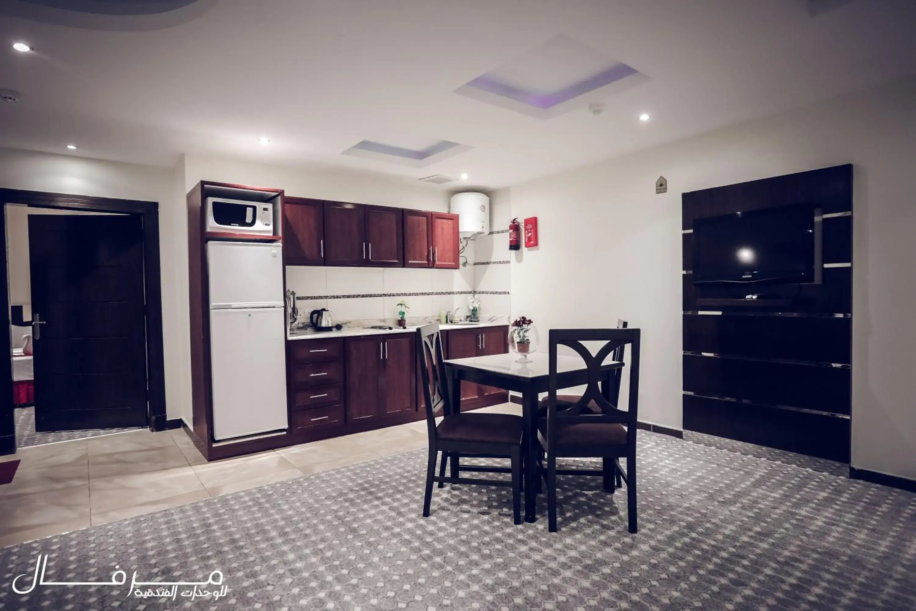 Kitchen or kitchenette, Dining Area in Merfal Hotel Apartments Al Taawan