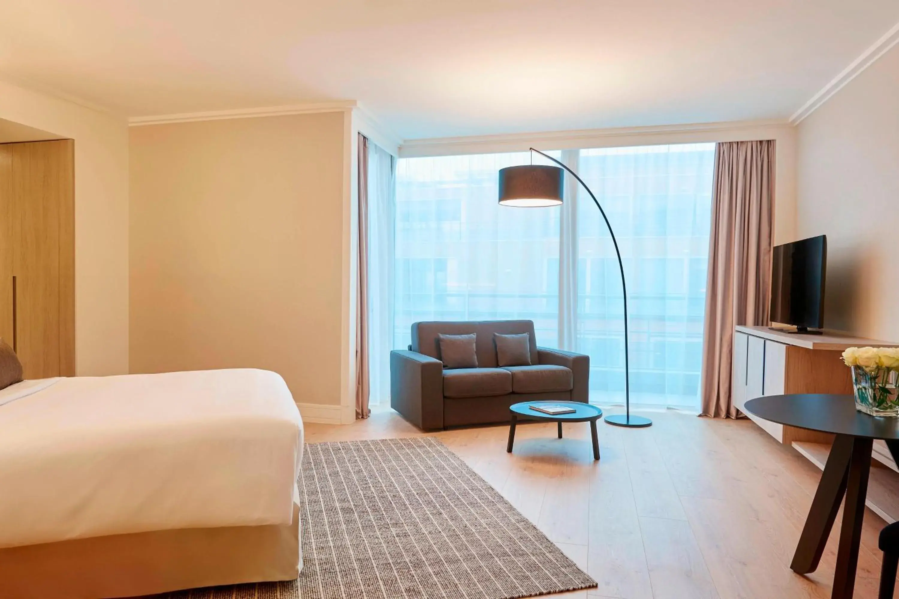 Bedroom, Seating Area in Lyon Marriott Hotel Cité Internationale