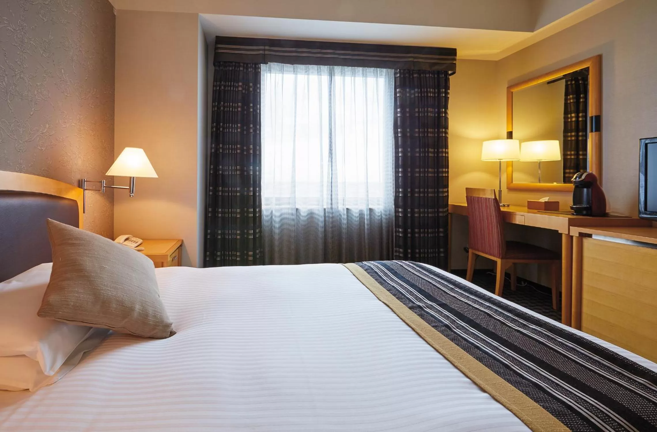 Bed in Royal Pines Hotel Urawa