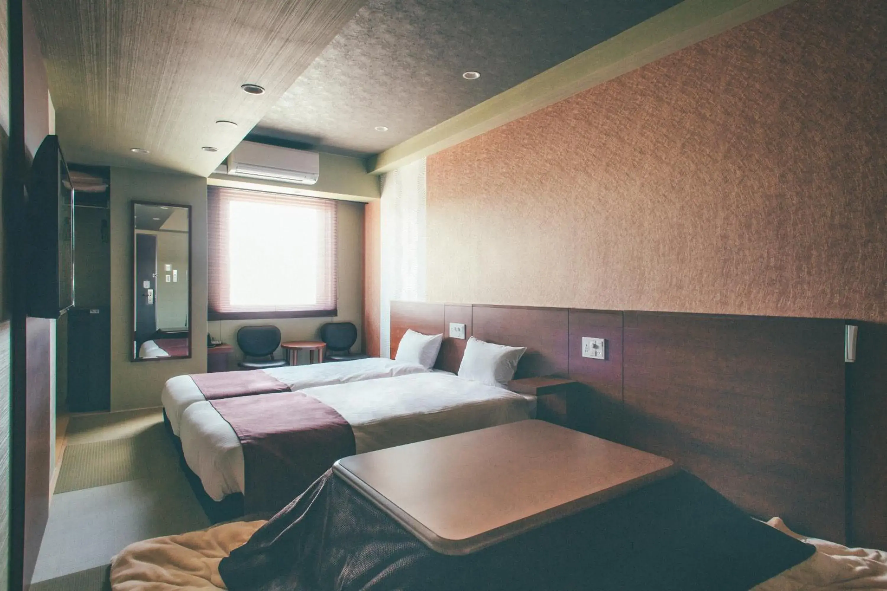 Bed in Hotel Kuretakeso Takayama Ekimae