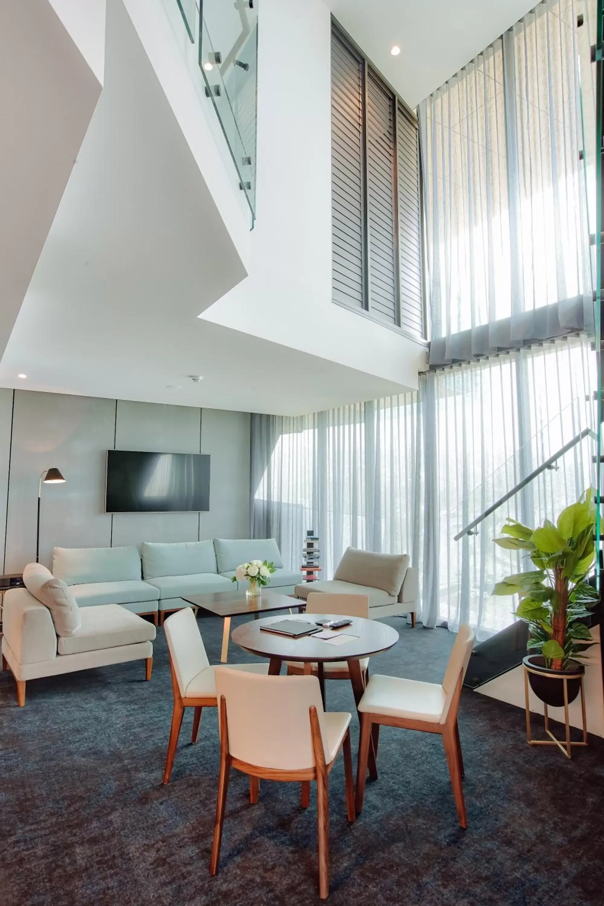 Living room, Dining Area in Eatons Hill Hotel