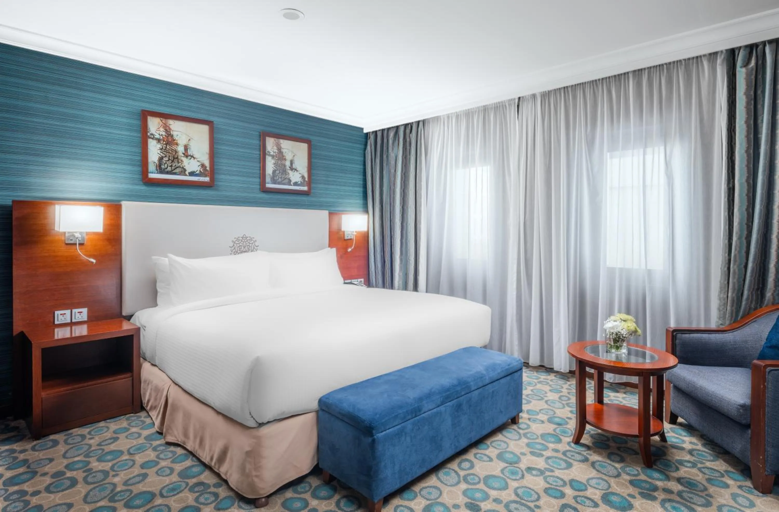 Bed in Millennium Al Aqeeq Hotel