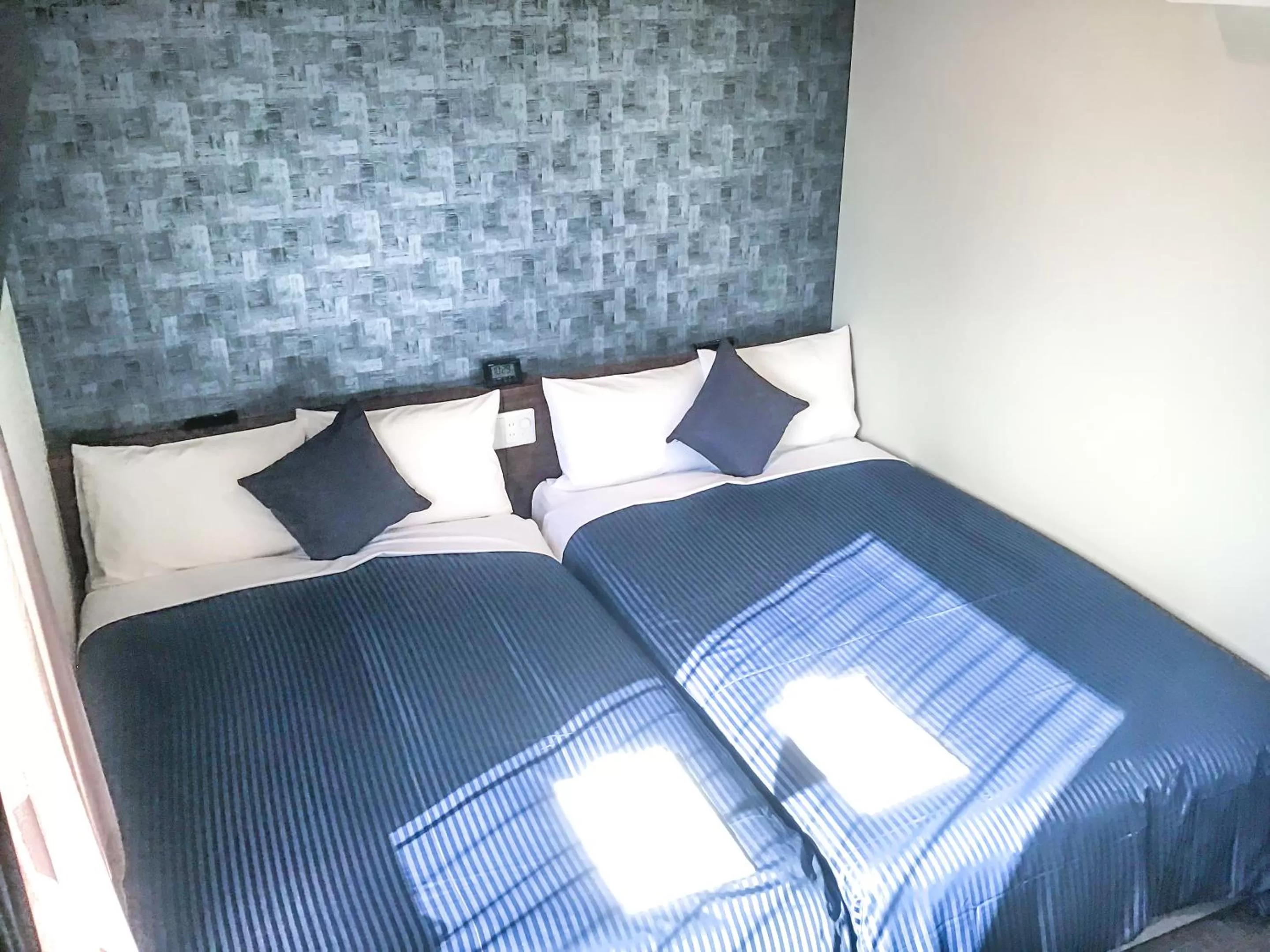 Bed in HOTEL LiVEMAX Okayama