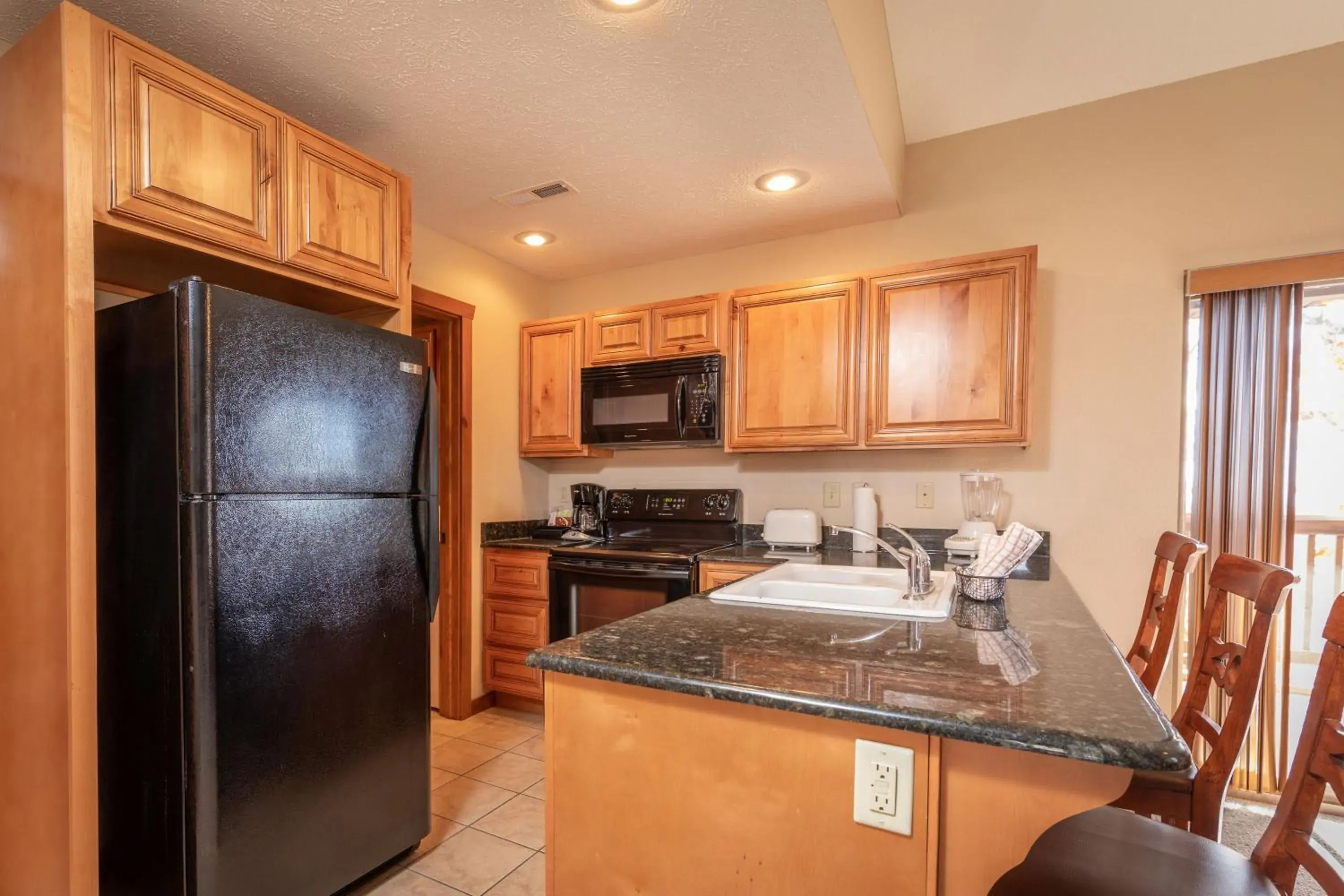 Kitchen or kitchenette, Kitchen/Kitchenette in The Lodges at Table Rock by Capital Vacations