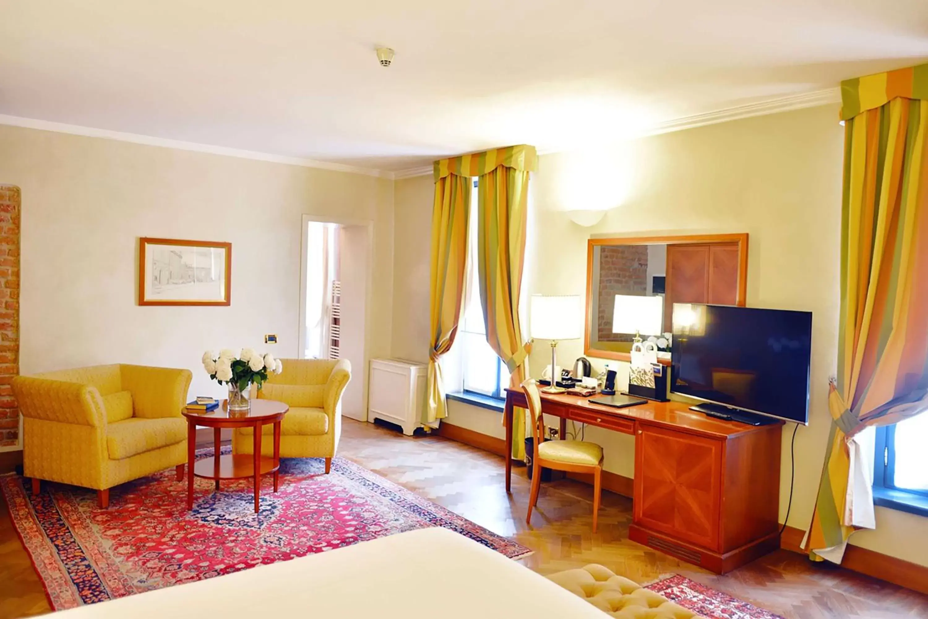 Bedroom, TV/Entertainment Center in Grand Hotel Villa Torretta, Curio Collection by Hilton