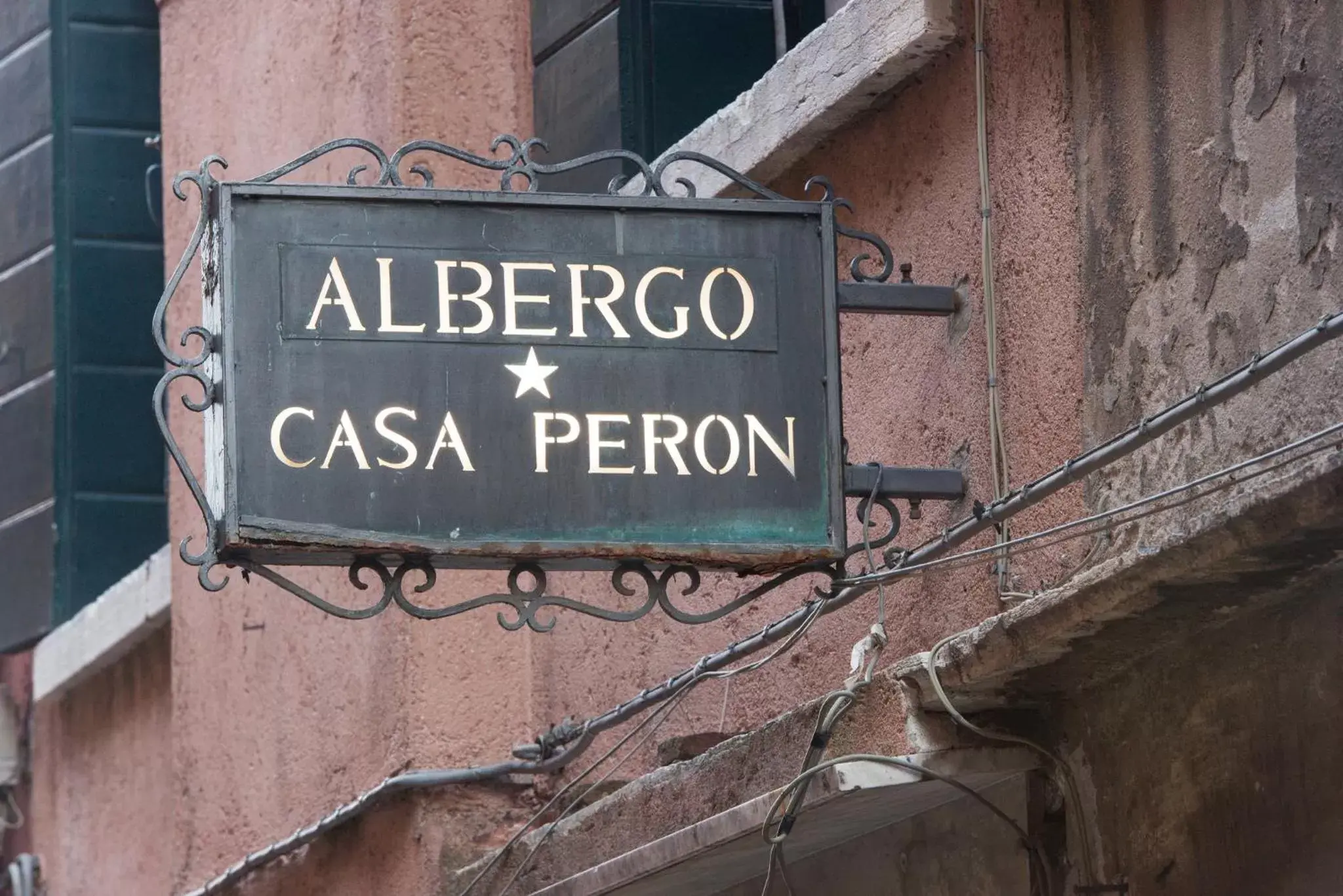 Property logo or sign in Albergo Casa Peron