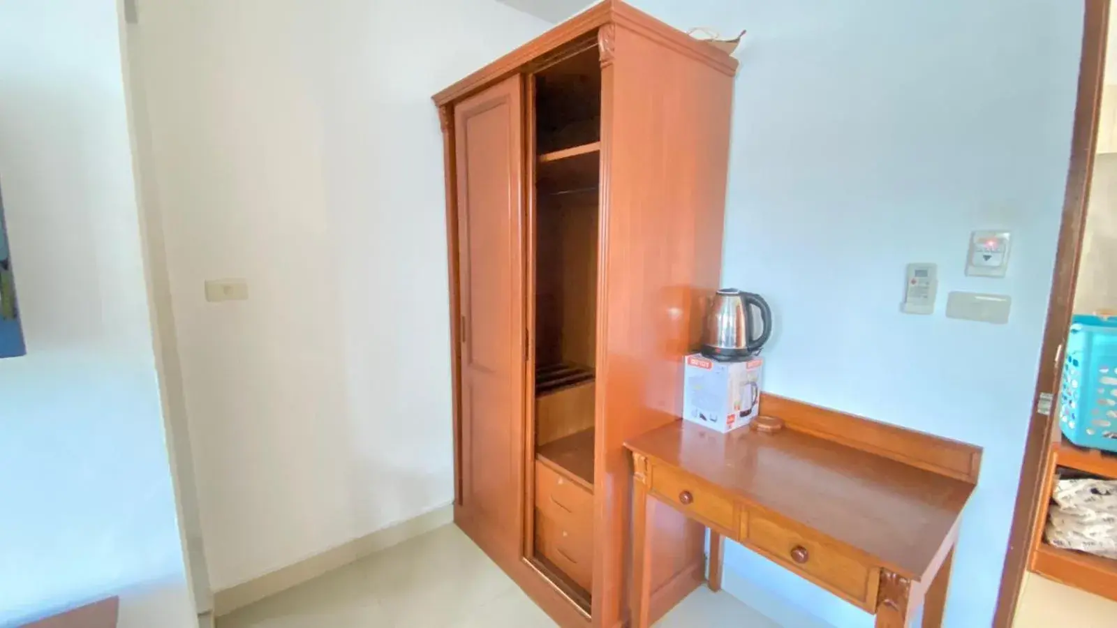 wardrobe, TV/Entertainment Center in Royal Swiss Guest House