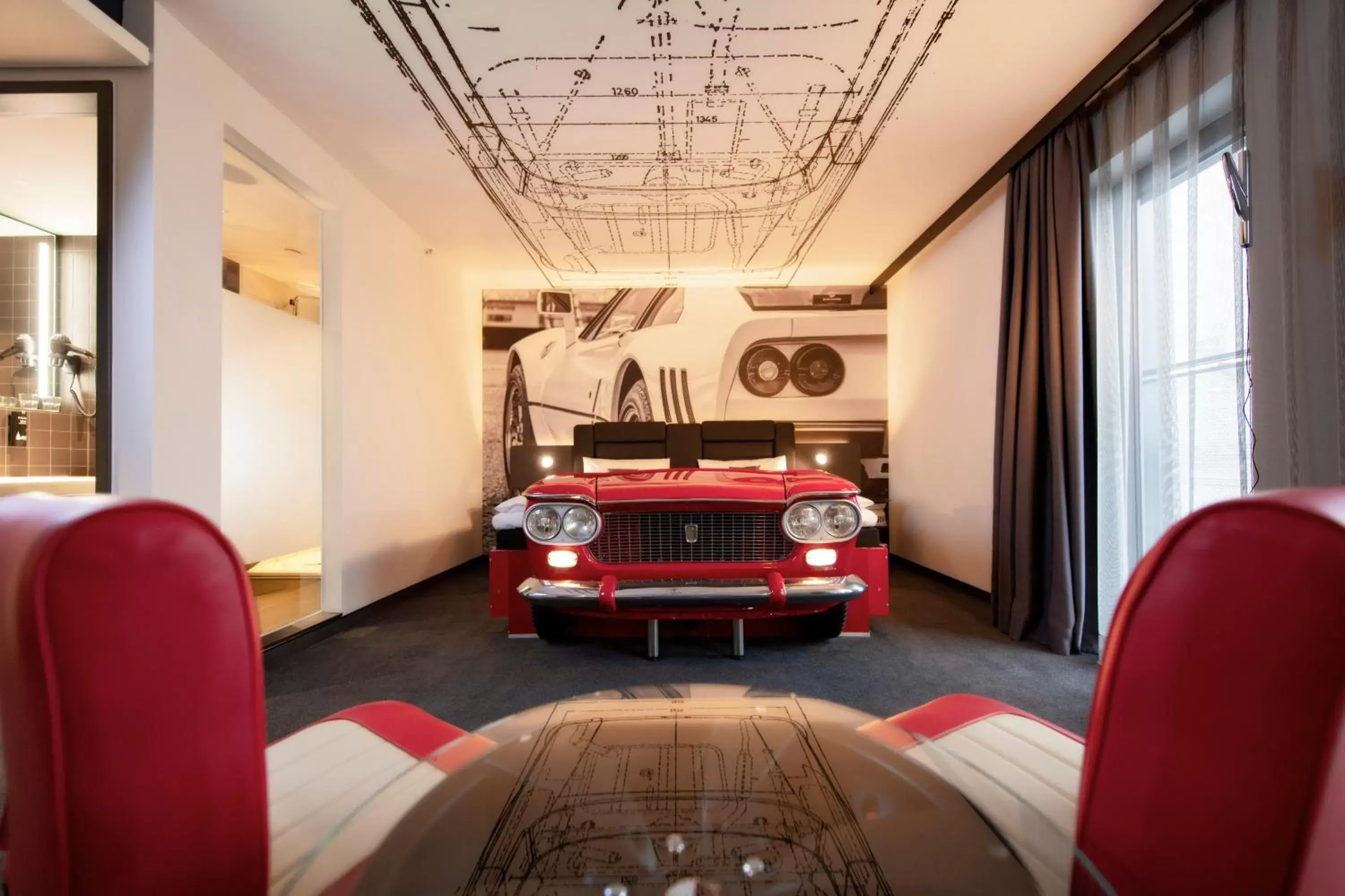 Photo of the whole room, Seating Area in V8 Hotel Köln at MOTORWORLD