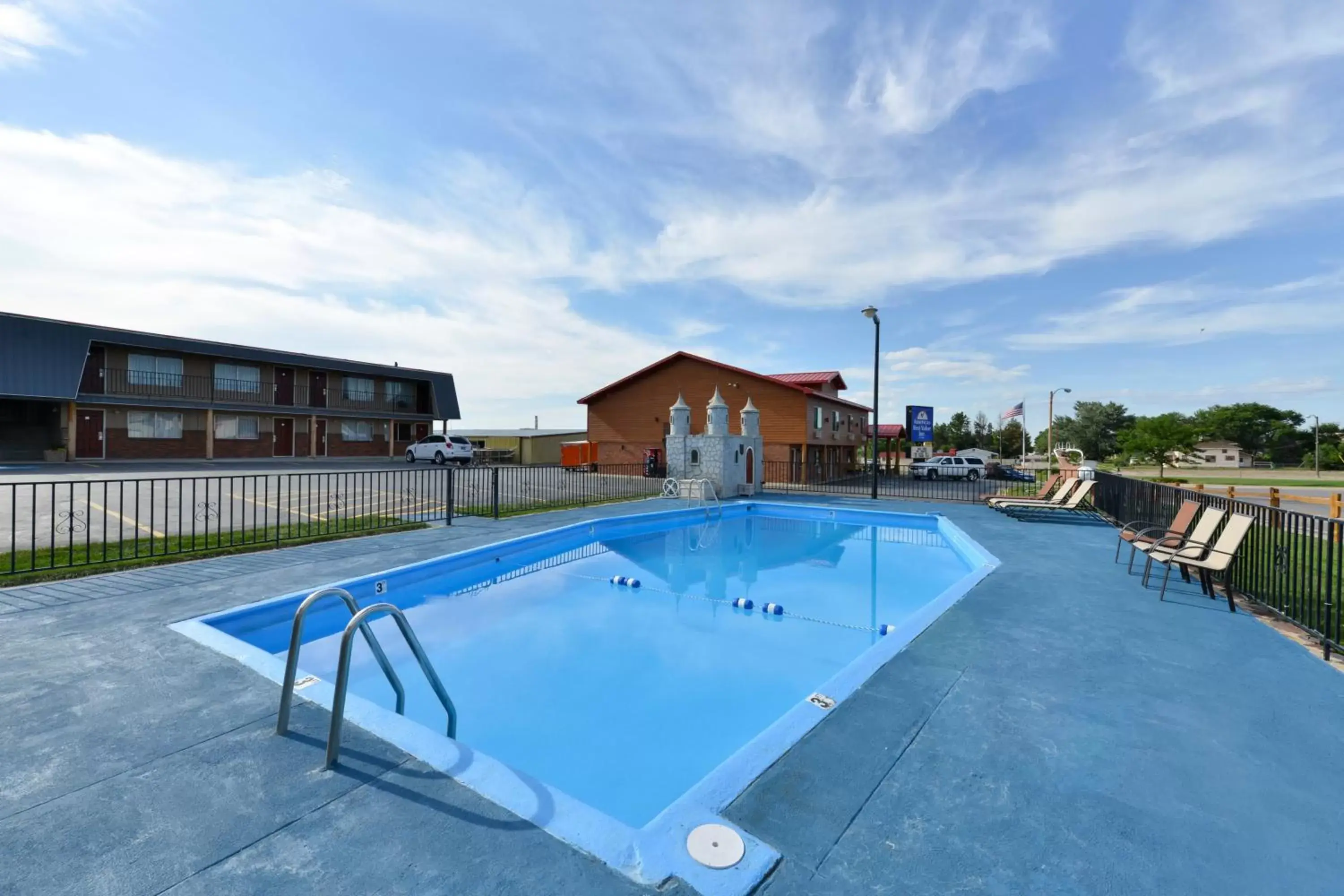 Swimming Pool in Americas Best Value Inn Wall