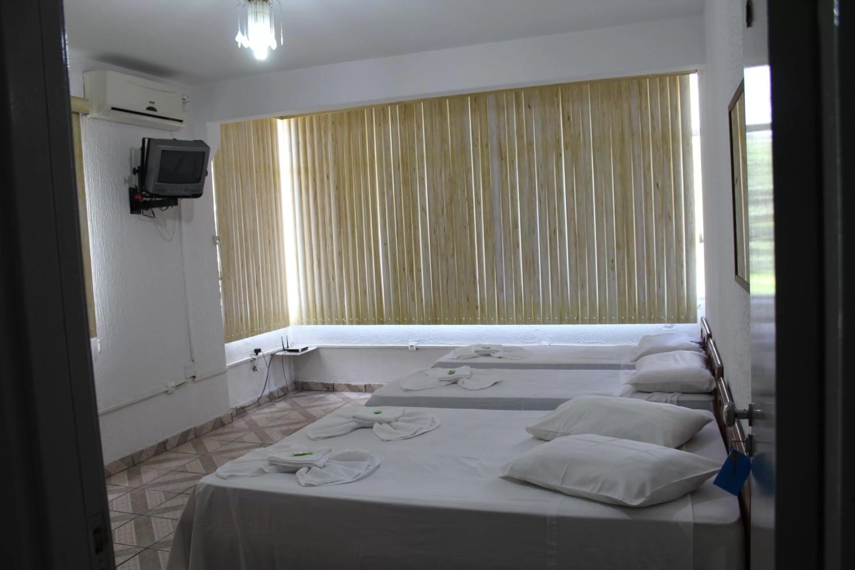 Photo of the whole room, Bed in Pousada Oliveira