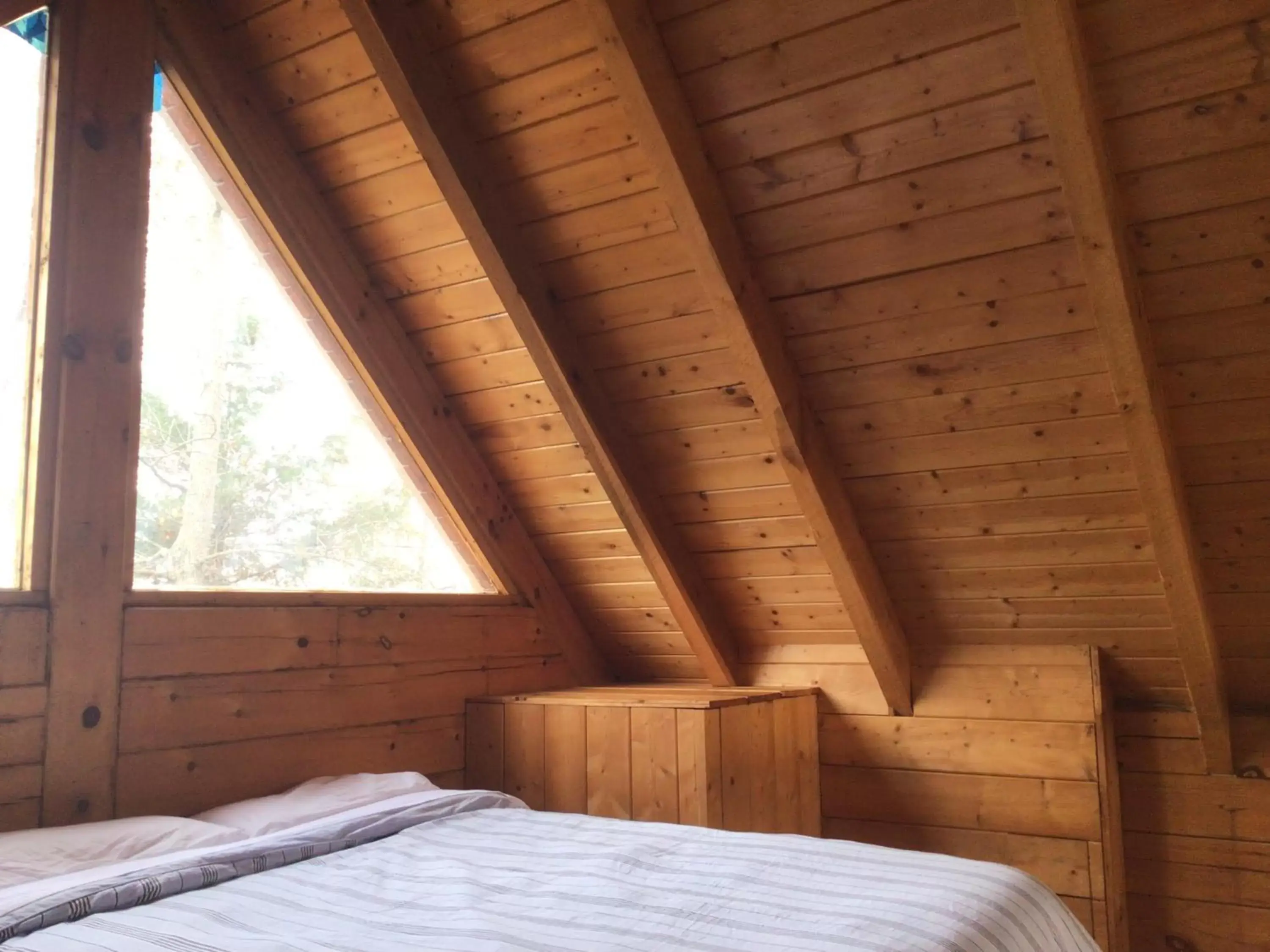 Bed in Kozy Haven Log Cabin Rentals