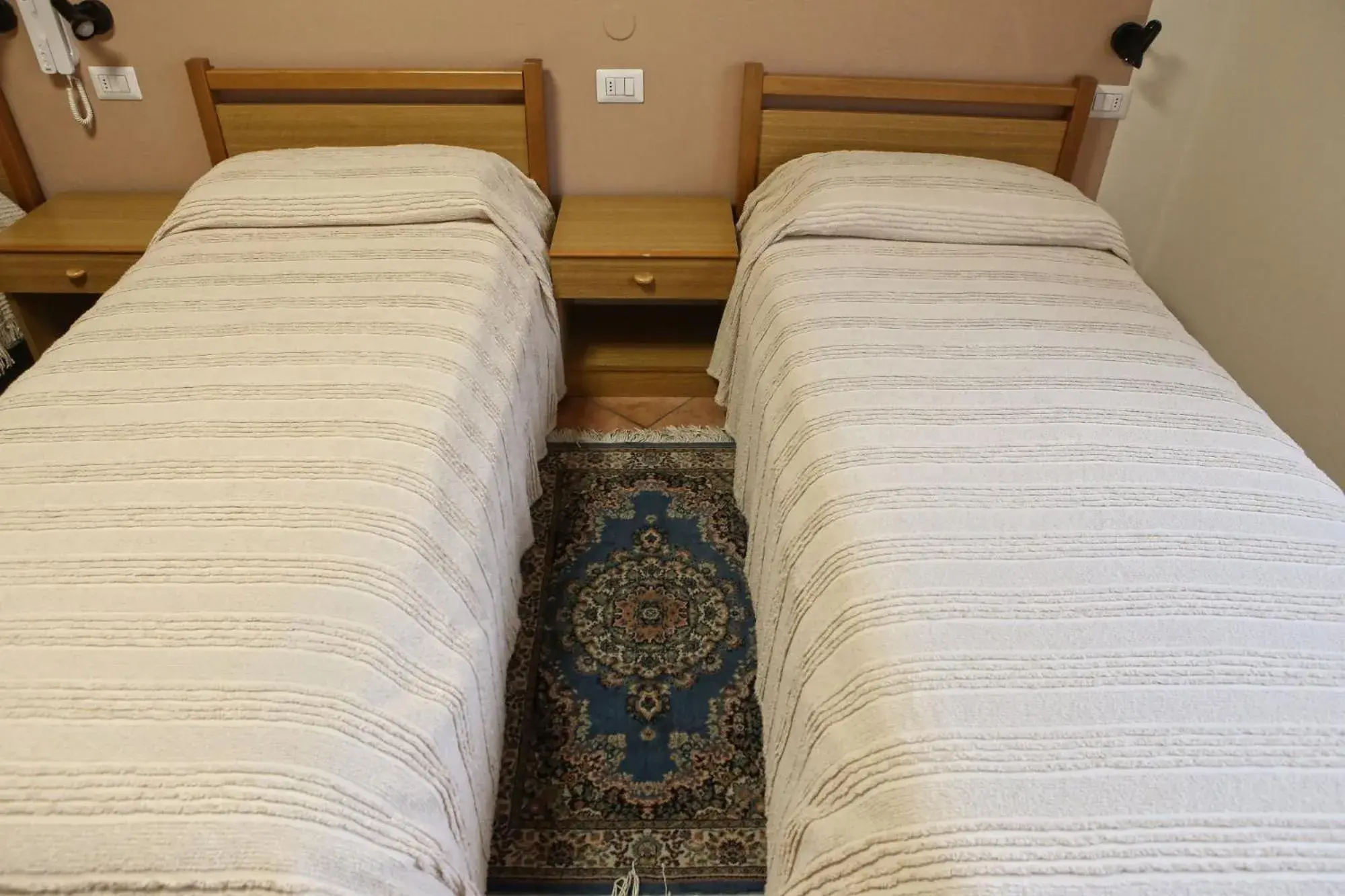 Bed in Albergo Gusmeroli