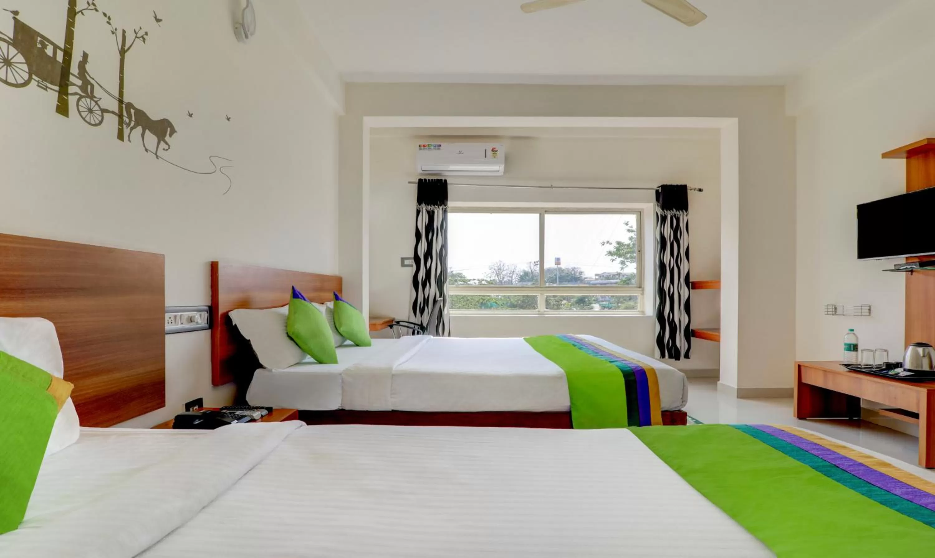 Bedroom, Bed in Treebo Atithi Comforts, 1 Km From Nisargadhama Forest