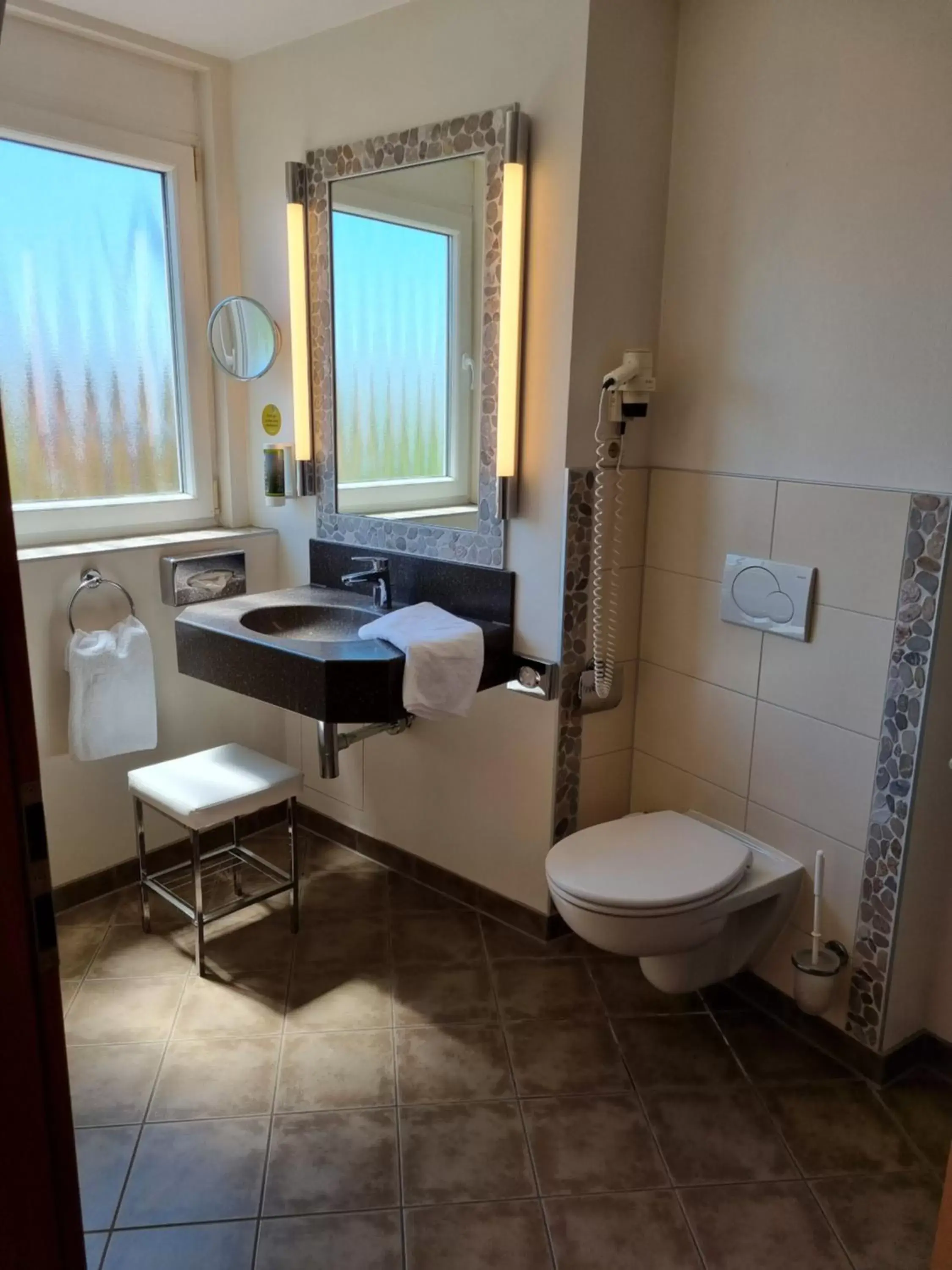 Bathroom in myMINGA4 - Hotel & serviced Apartments