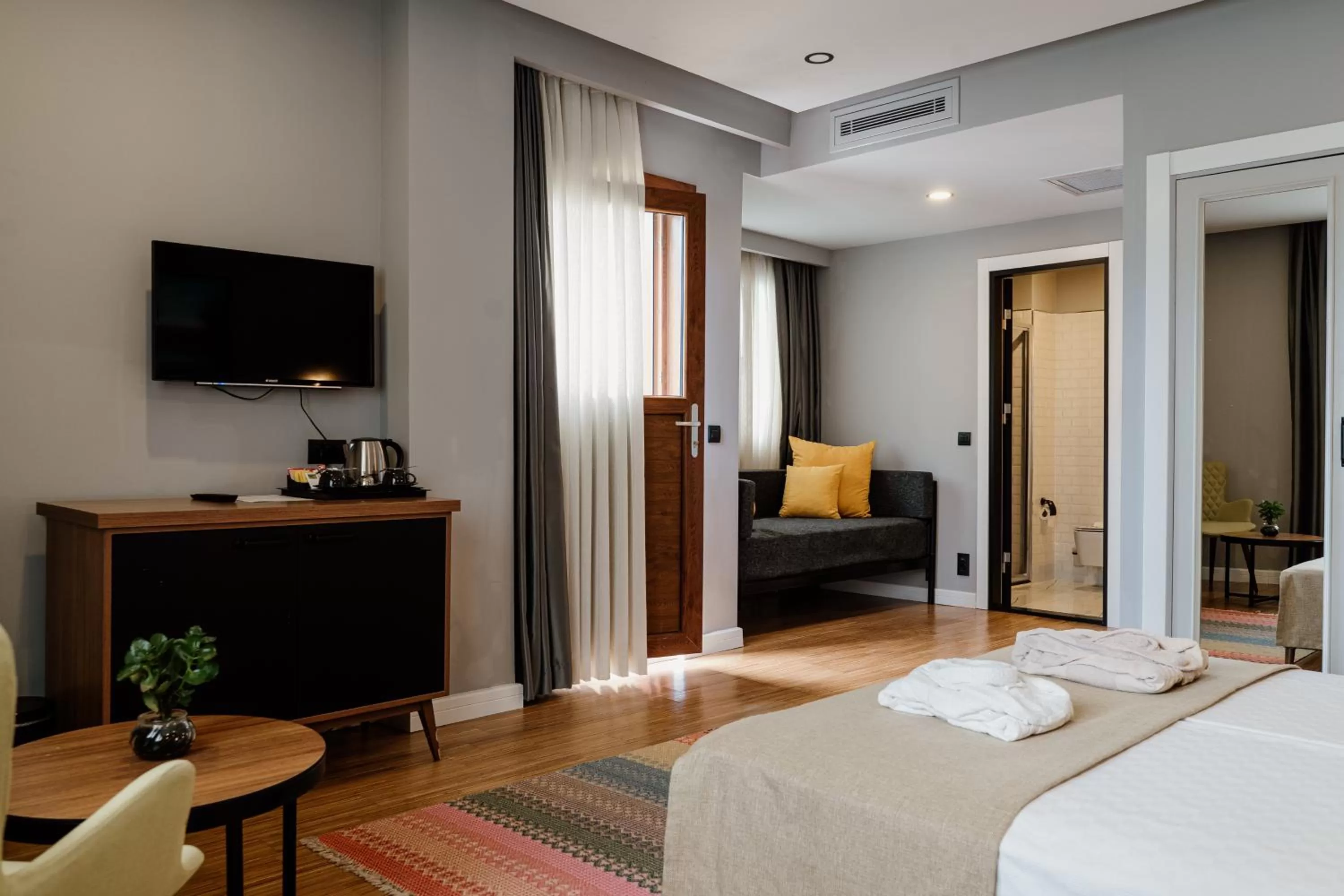 Photo of the whole room, Bed in Hotel Poem