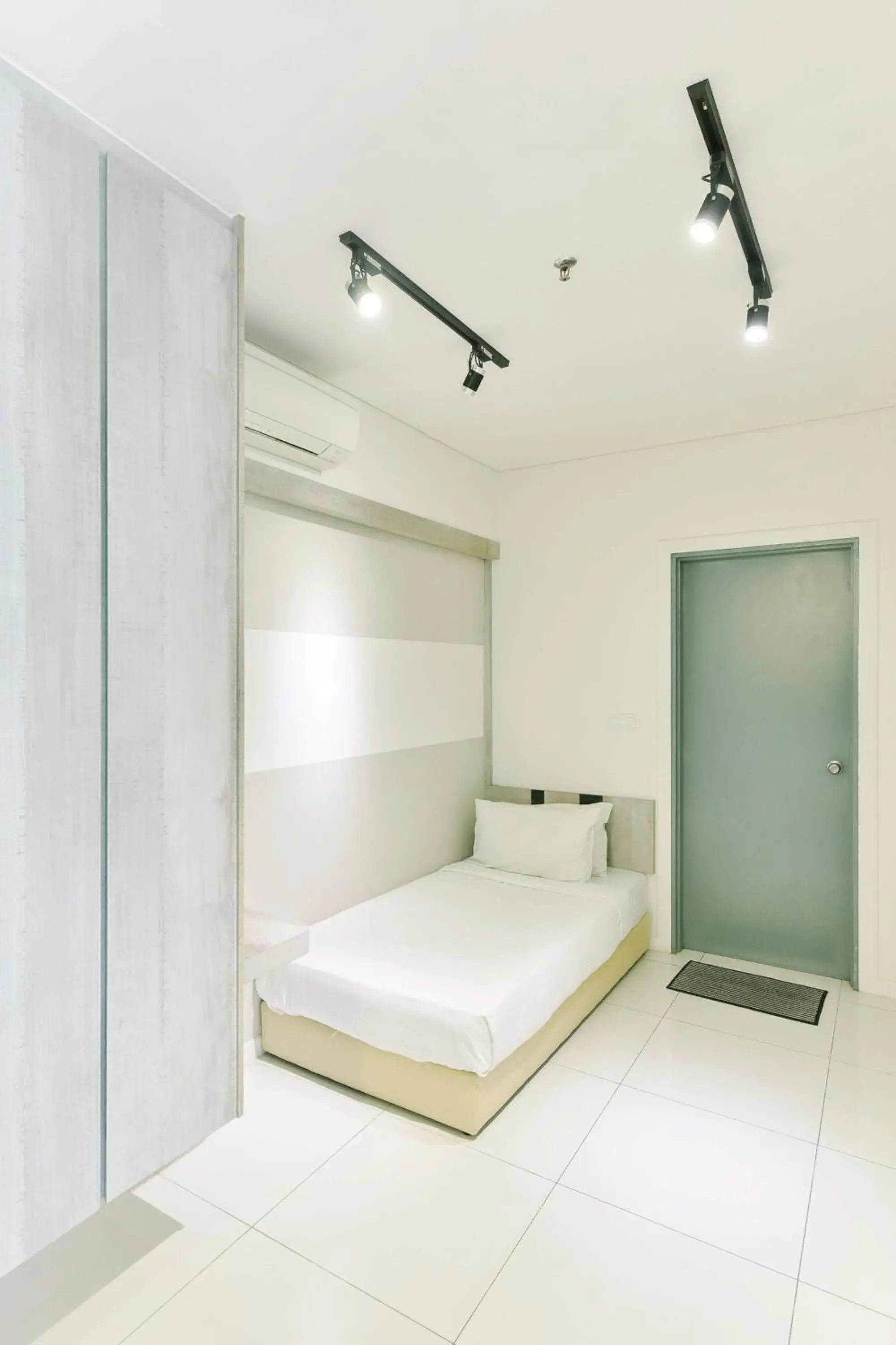 Bed in Summer Suites Residences by Subhome