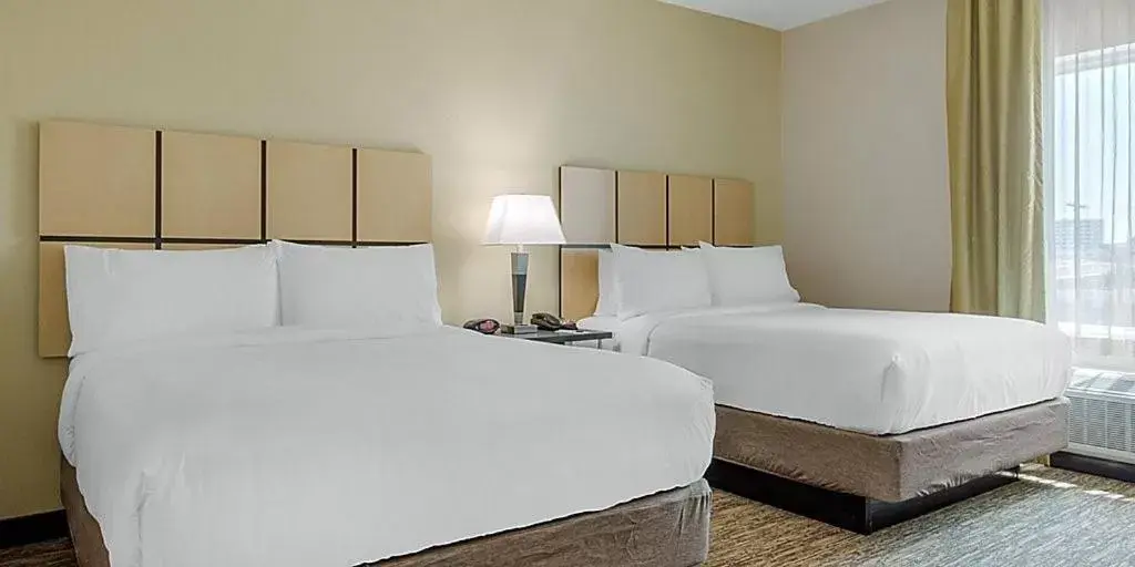 Bed in Candlewood Suites San Antonio Airport, an IHG Hotel