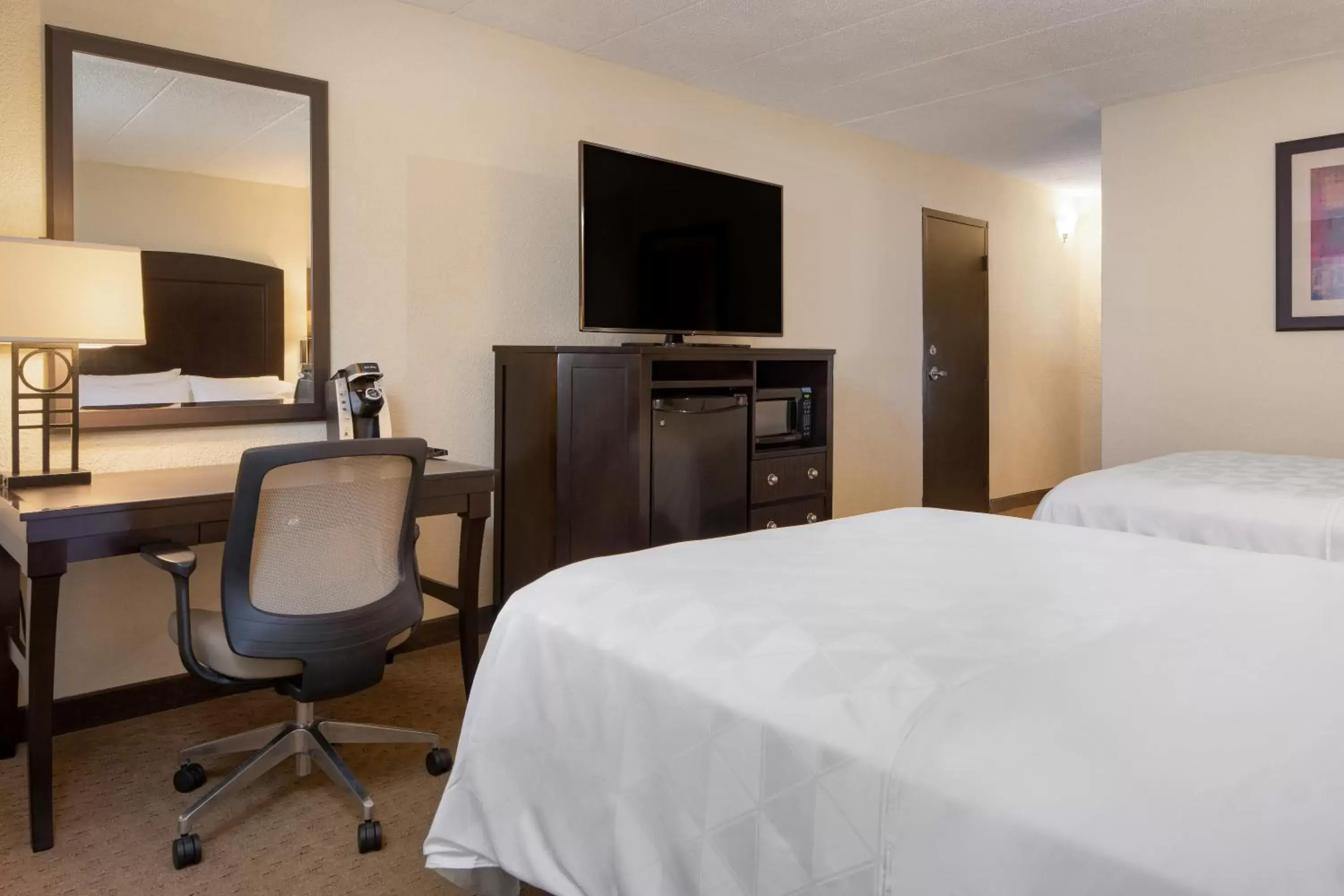 Photo of the whole room, TV/Entertainment Center in Holiday Inn and Suites Charleston West, an IHG Hotel