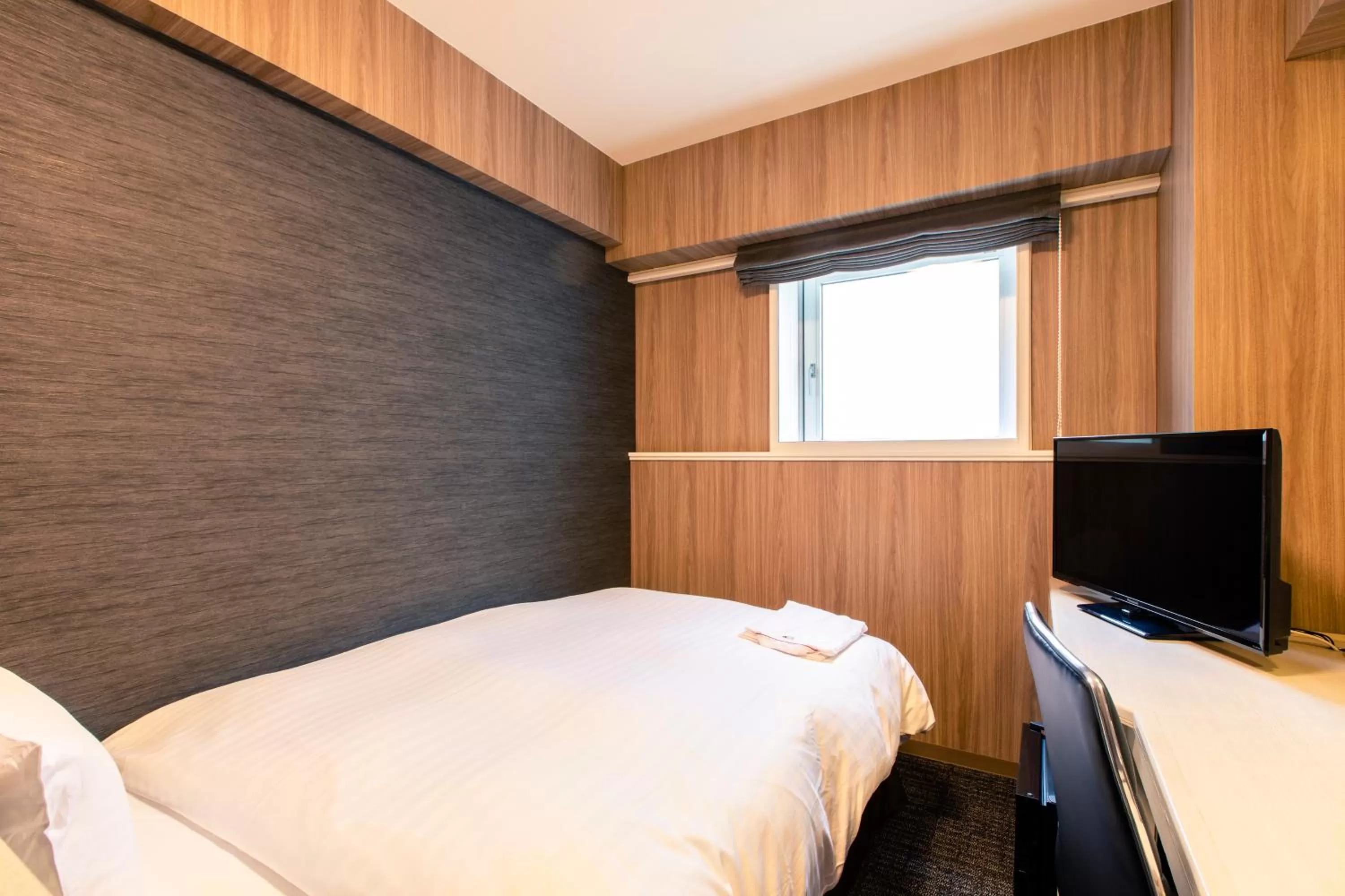 Bed in Hotel Wing International Asahikawa Ekimae