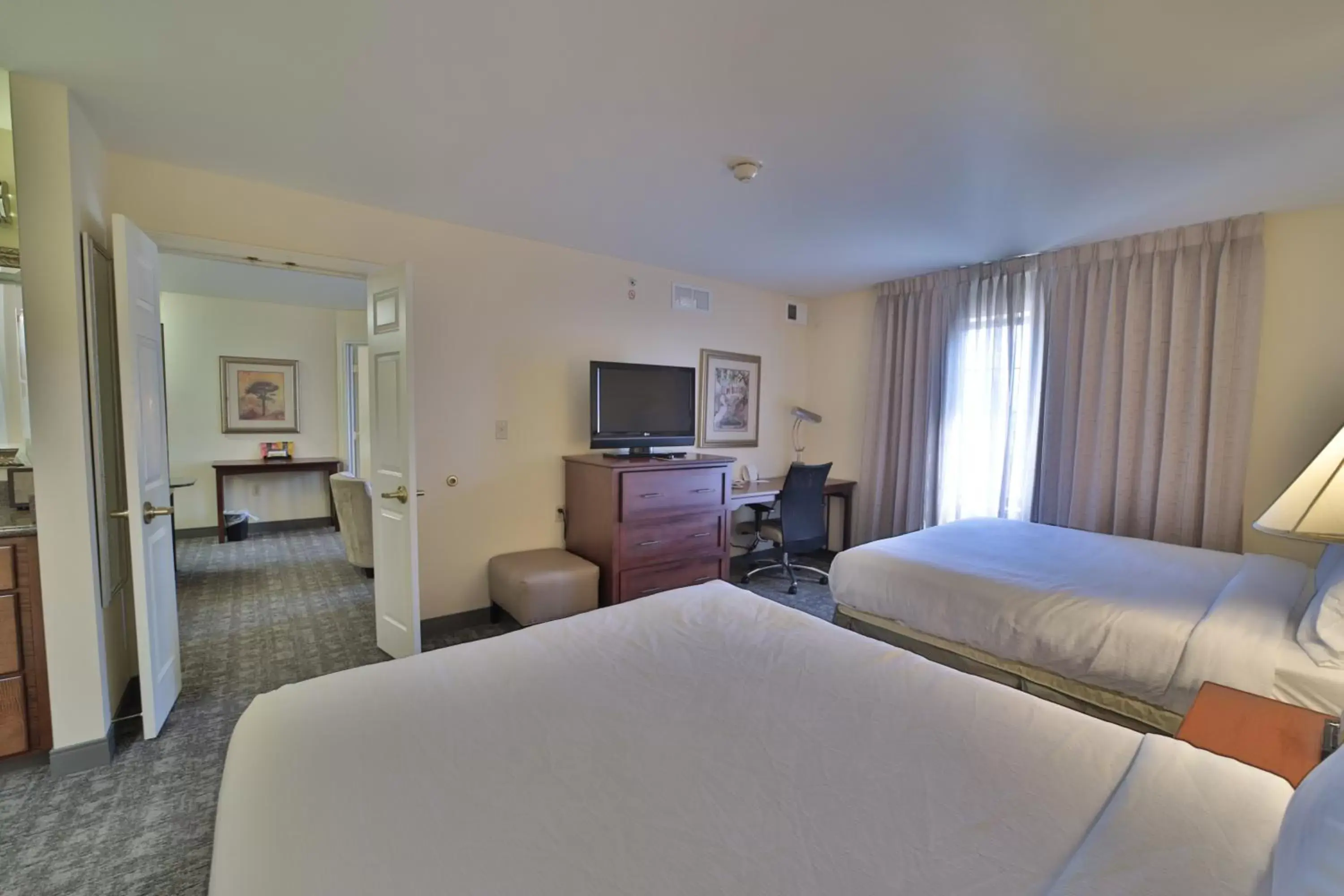 Bed in Staybridge Suites Lansing-Okemos, an IHG Hotel