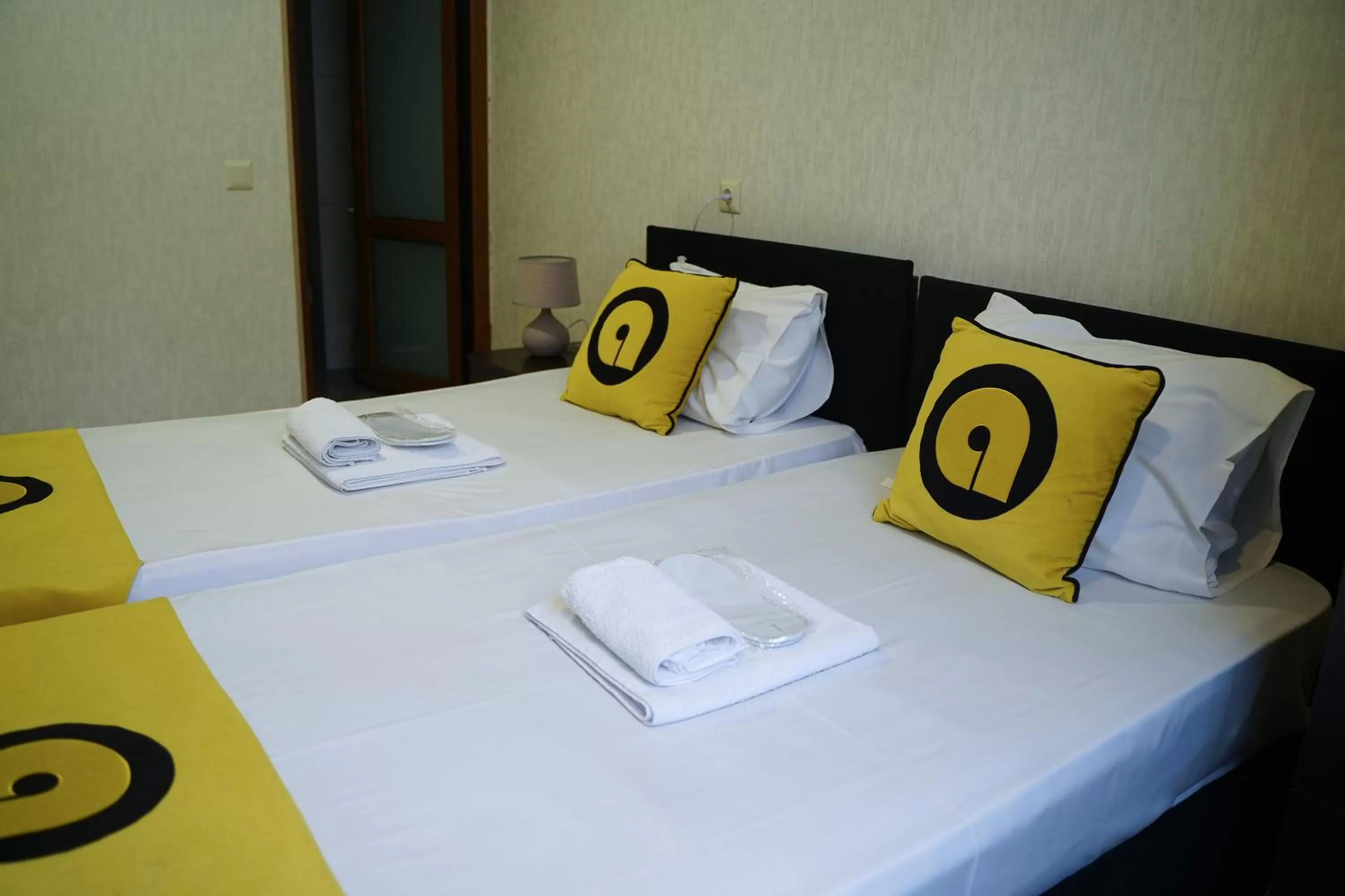 towels, Bed in Aura Plaza Hotel