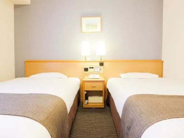 Bed in Smile Hotel Wakayama